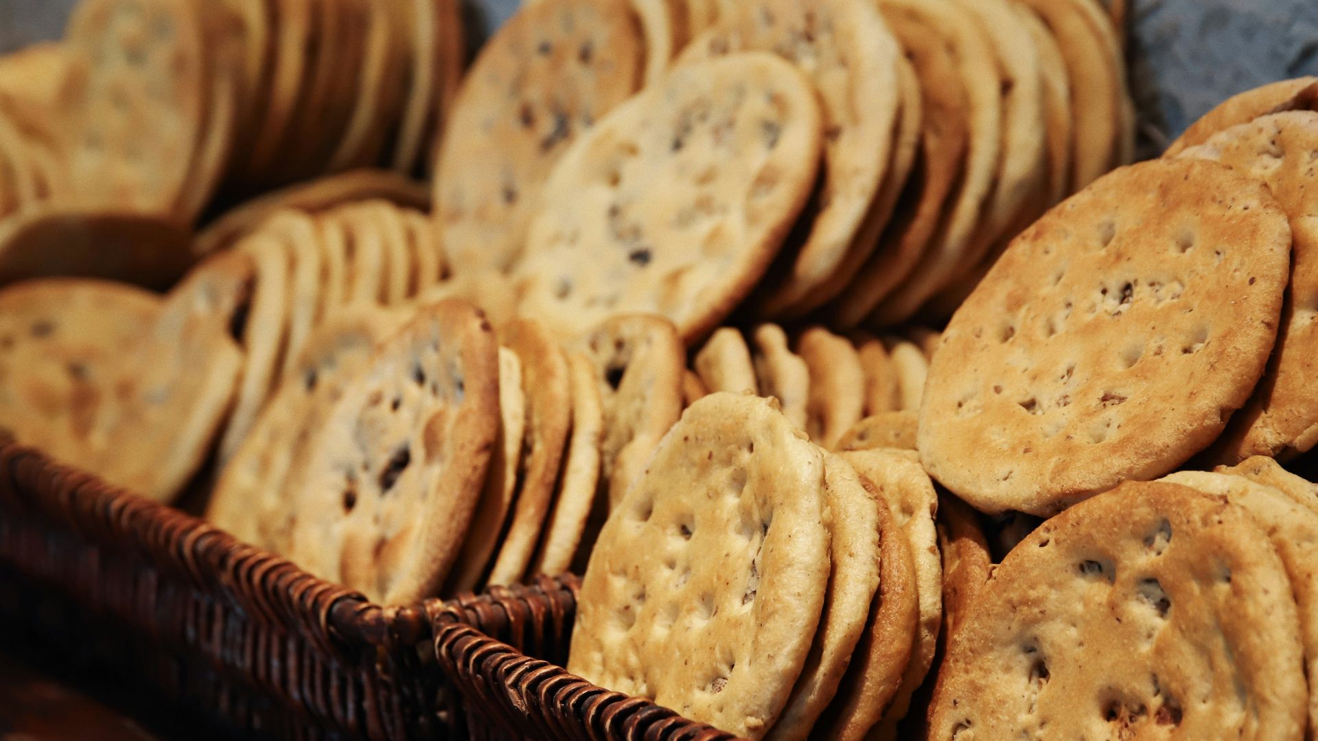a basket full of cookies sitting on top of a table