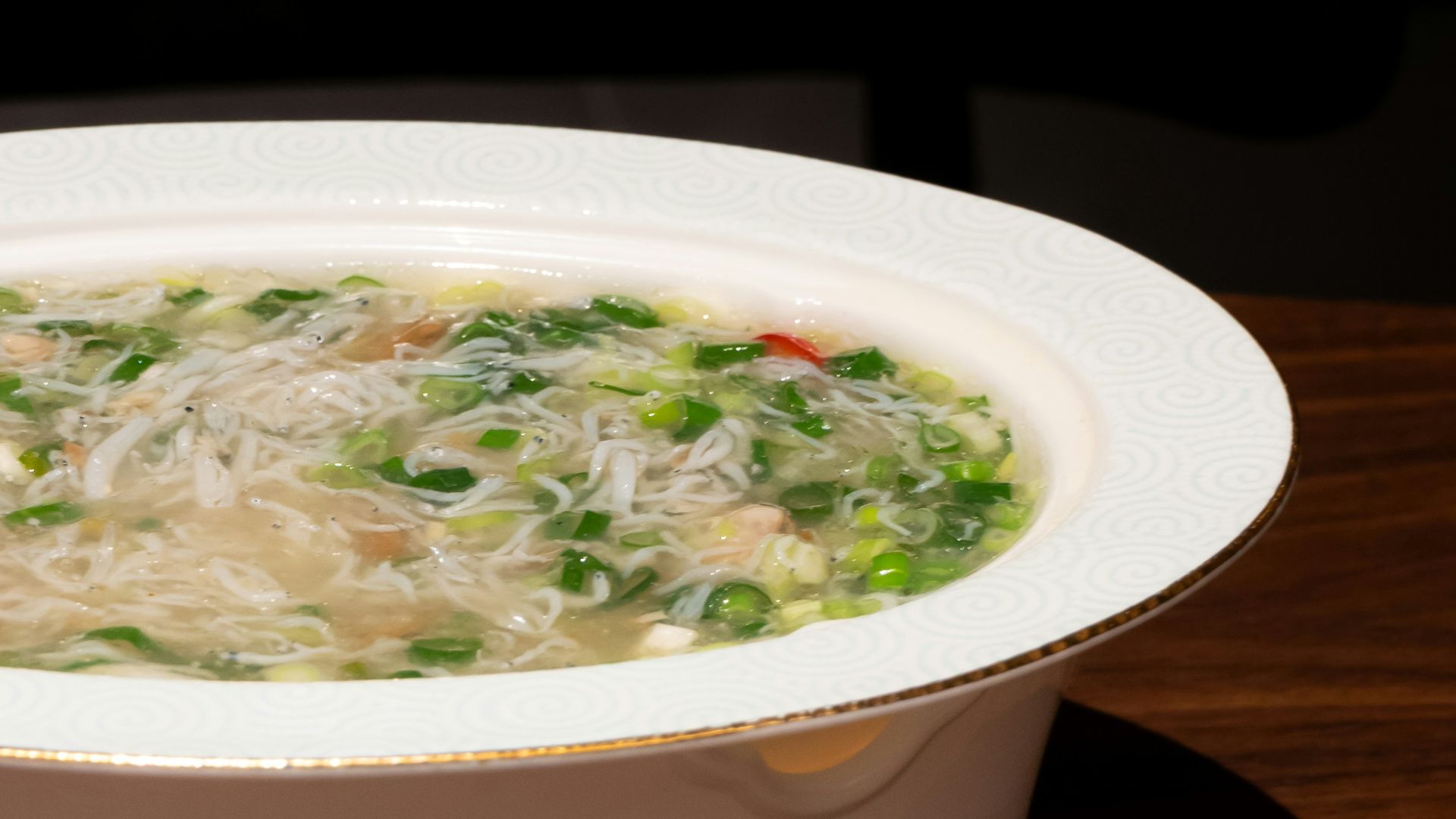 a bowl of soup is sitting on a table