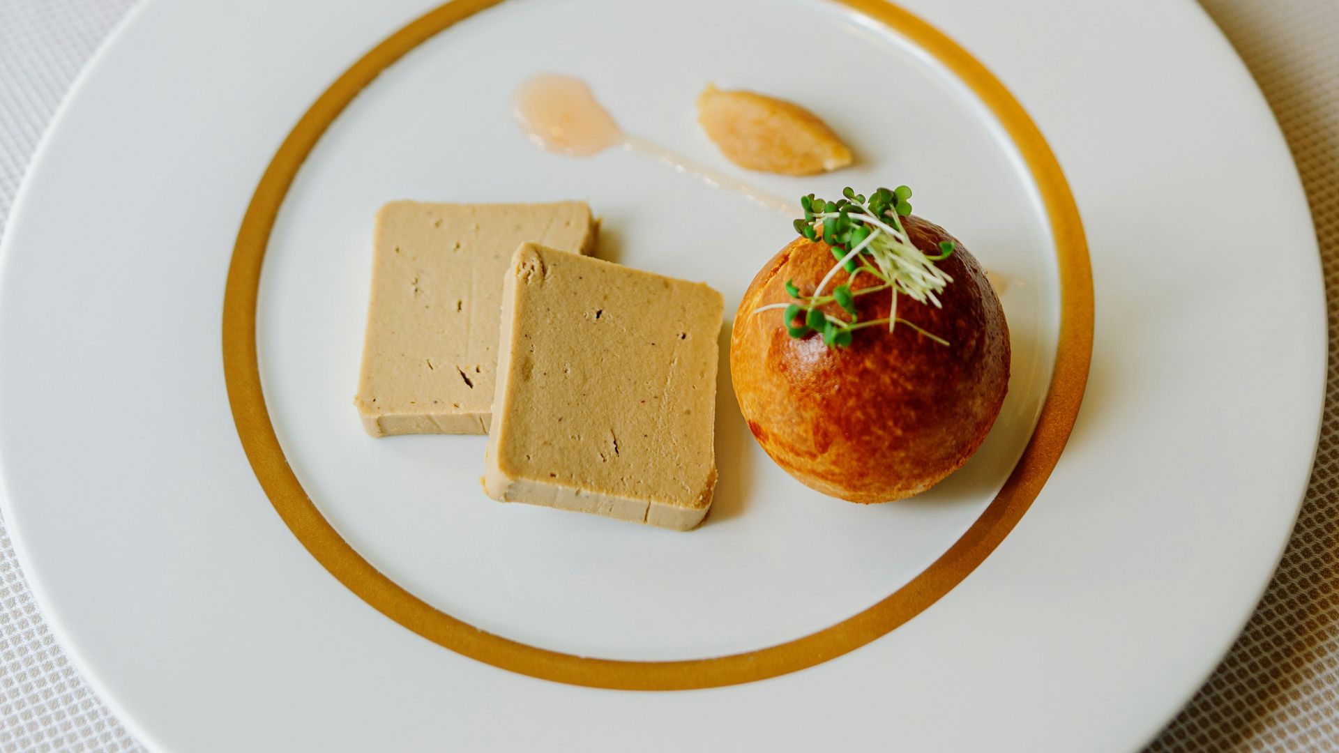 a white plate topped with food on top of a table