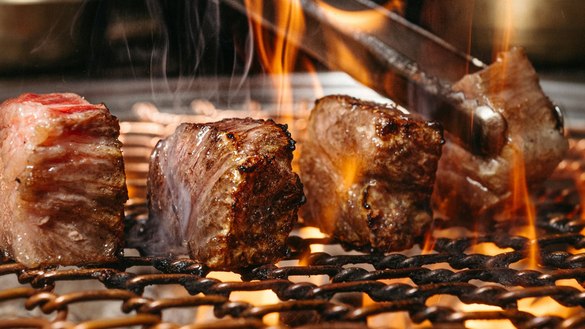 a close up of a grill with food on it