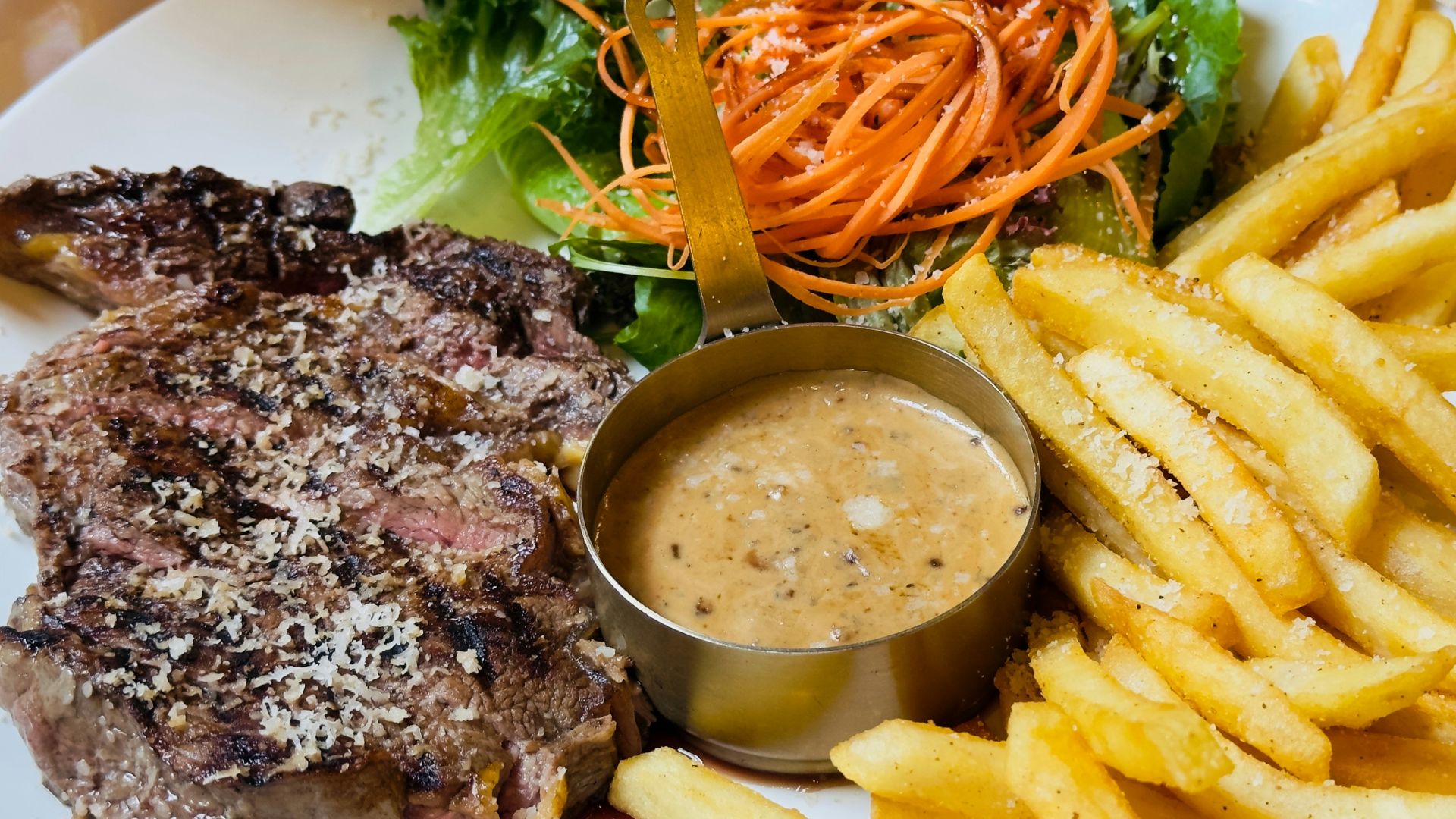 Steak with french fries and side salad