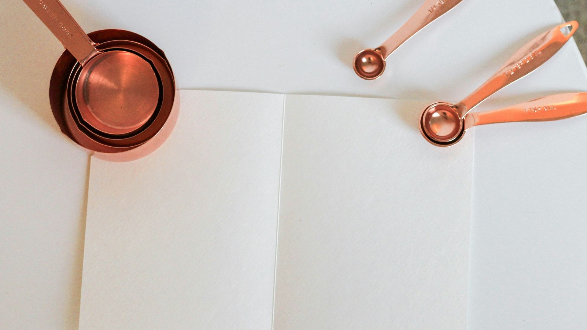 measuring cup on white paper