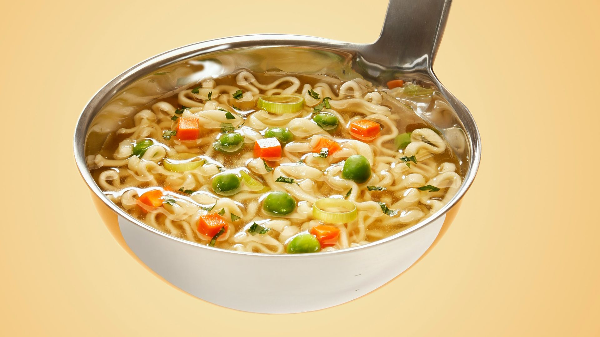 silver steel scoop with noodles