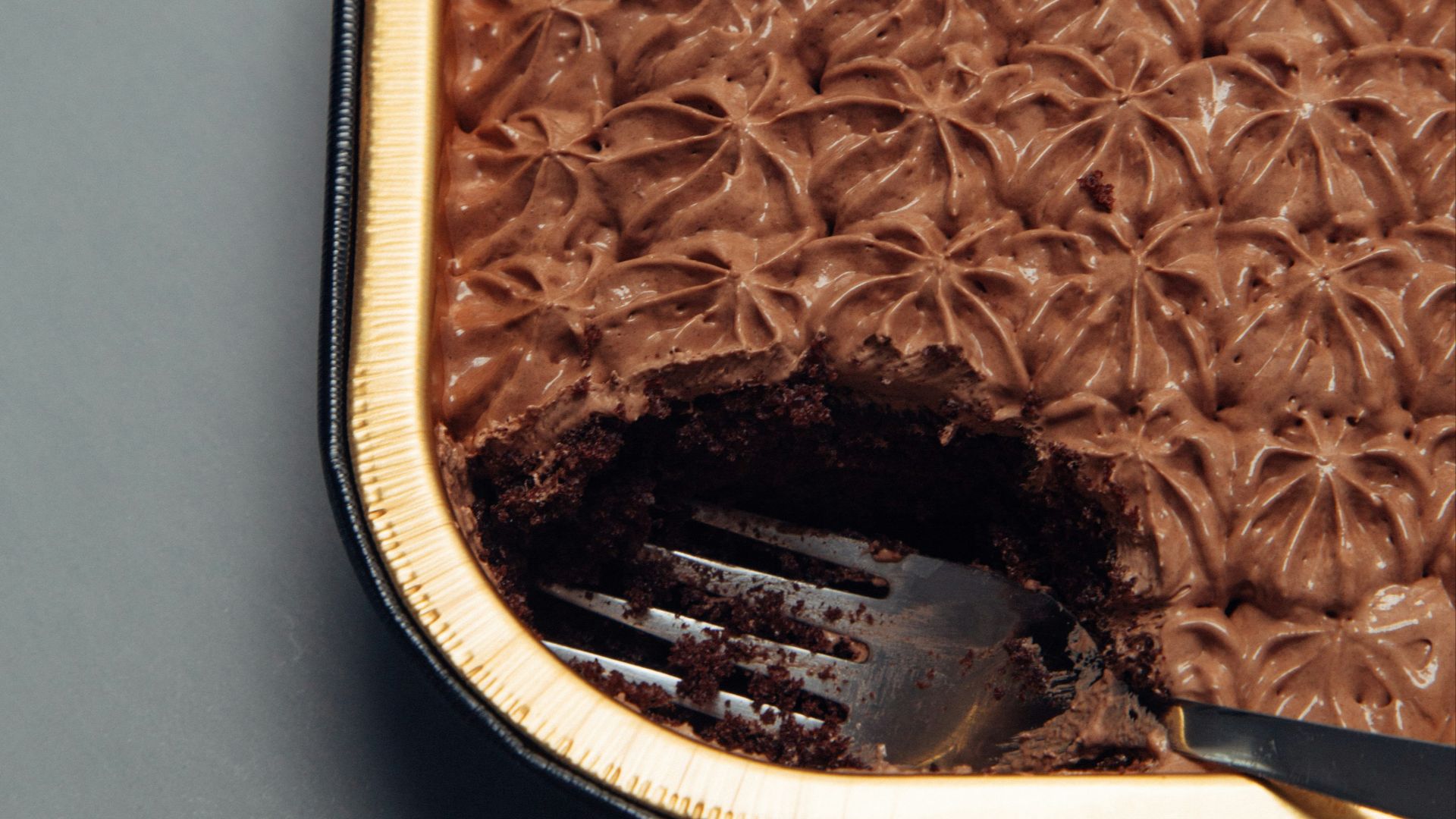 stainless steel fork in cake