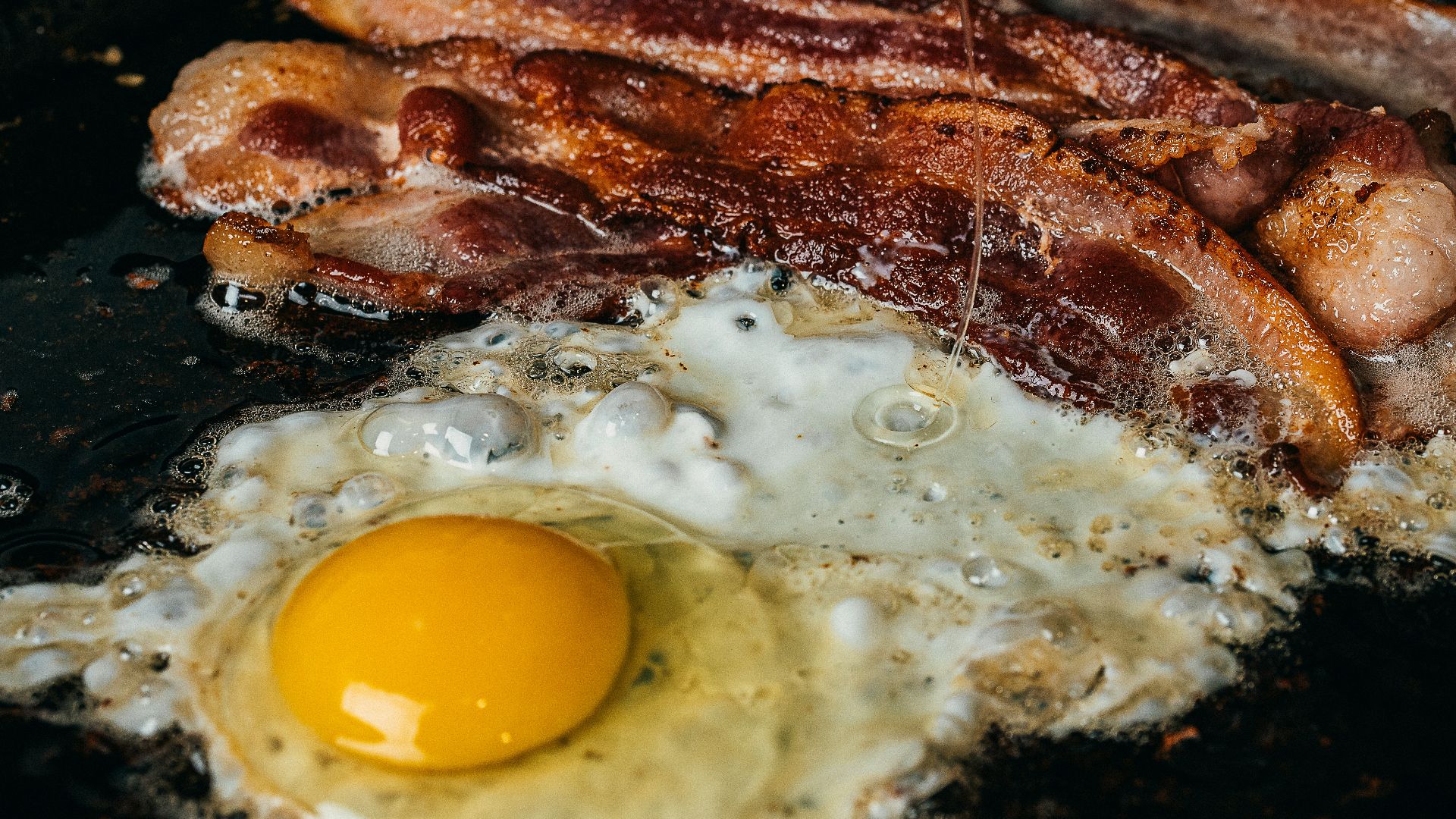 fried egg on black pan
