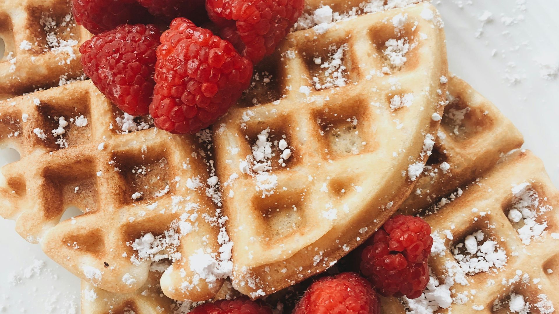 red strawberries on brown waffles