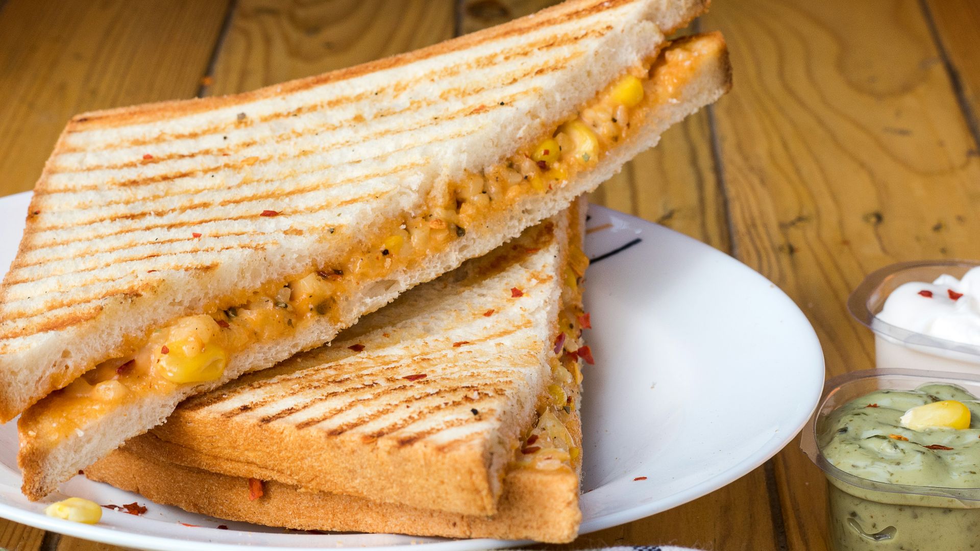 bread with cheese fillings on white ceramic plate