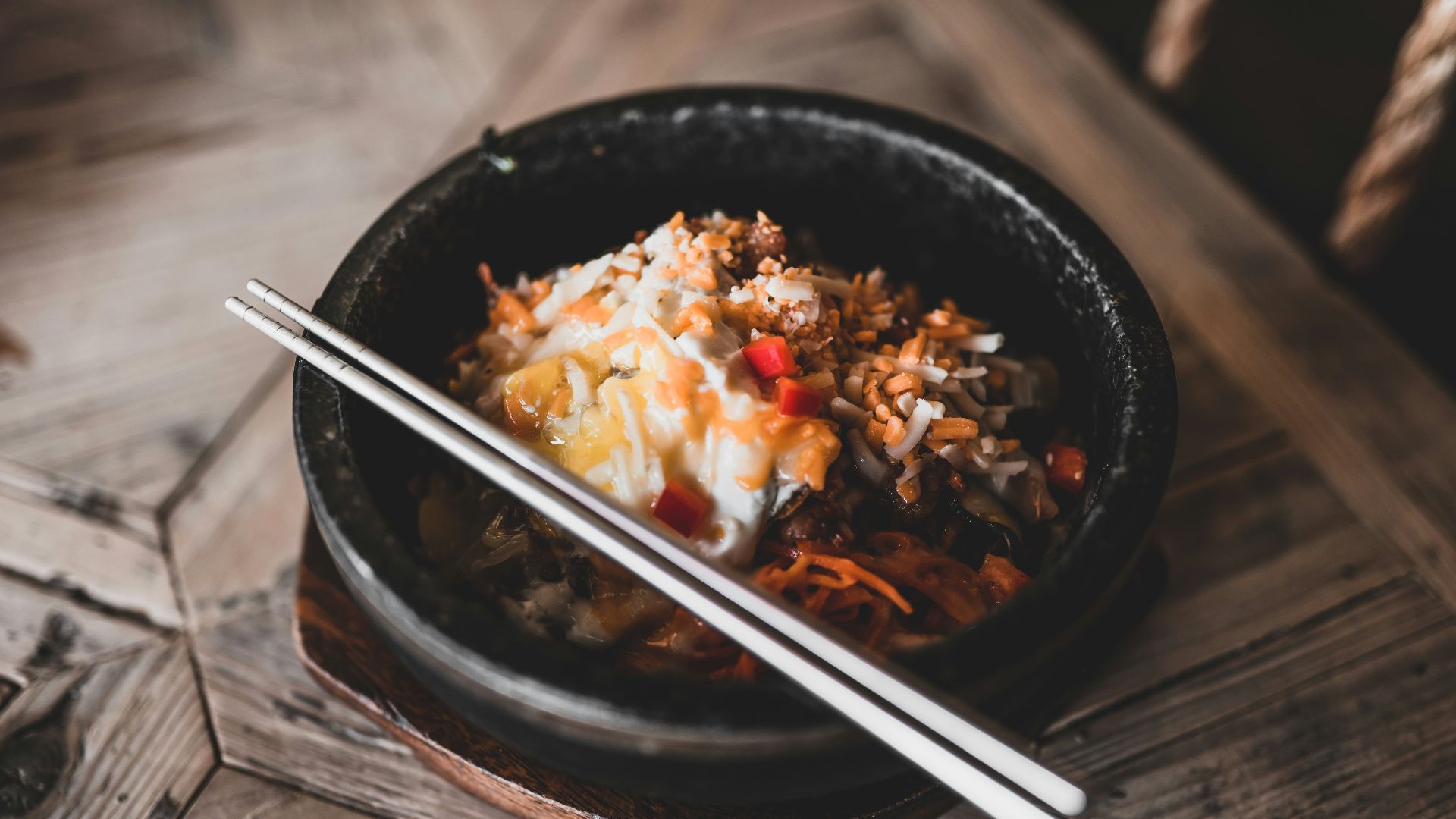 black ceramic bowl with chopsticks