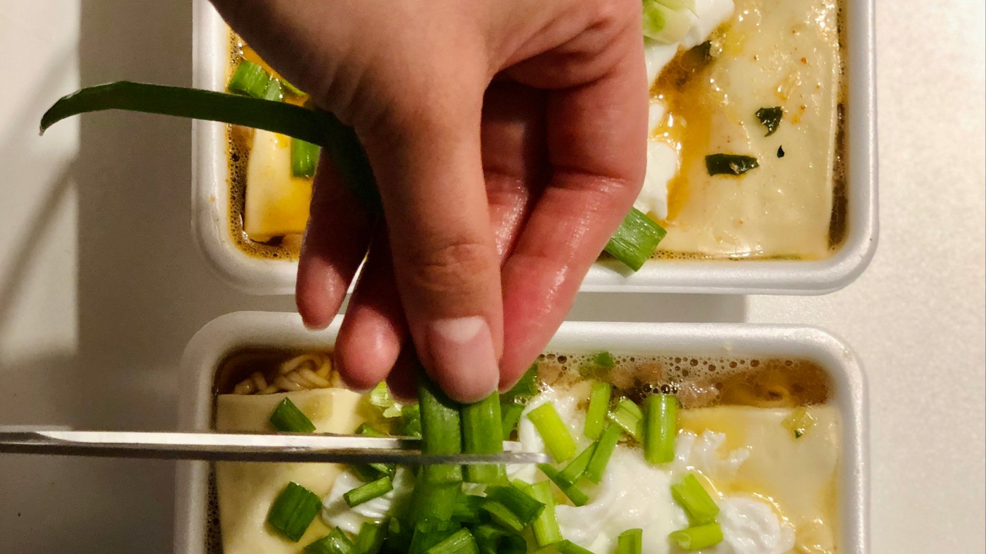 person holding green vegetable salad
