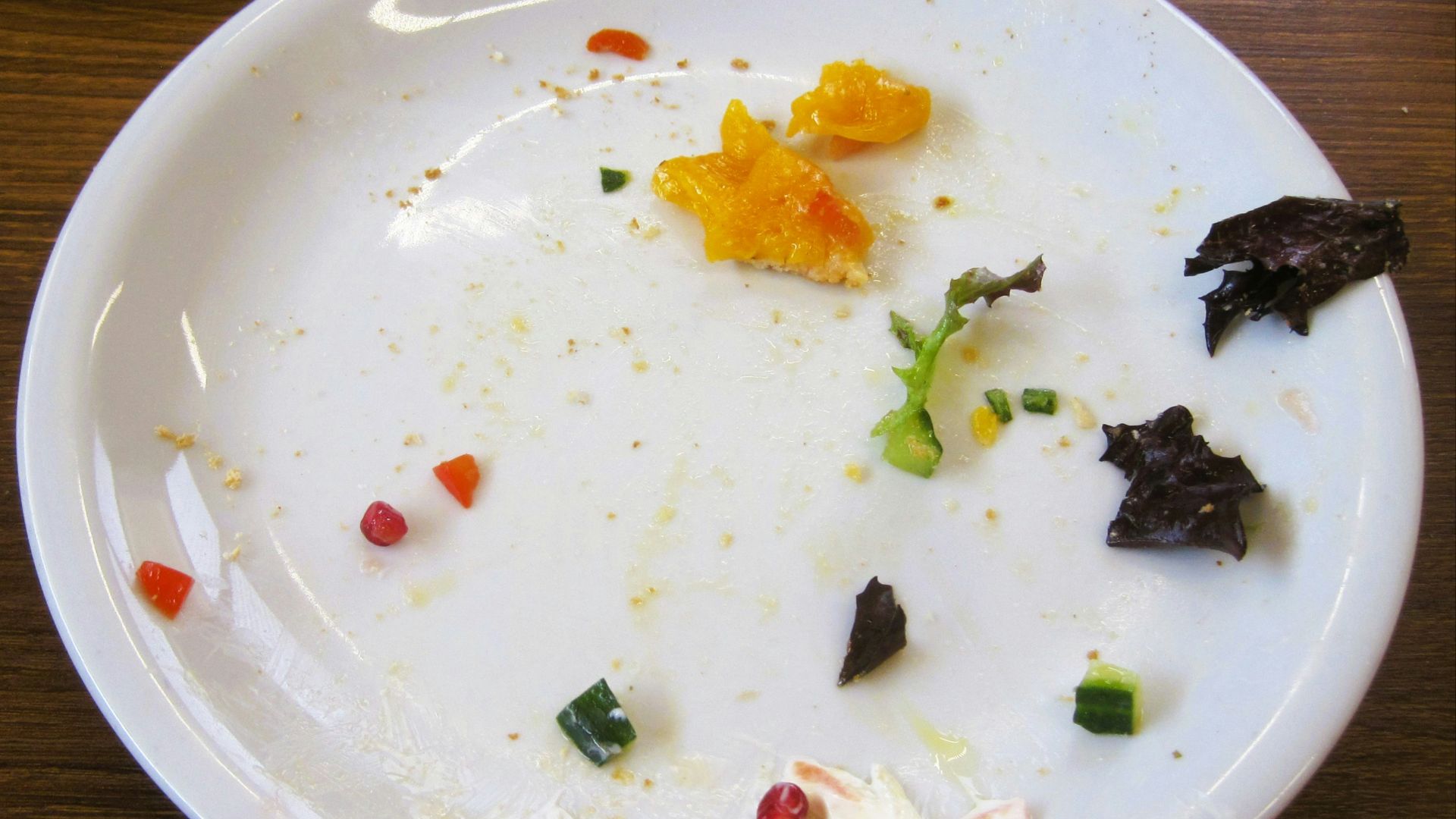 The plate shows leftover food scraps.