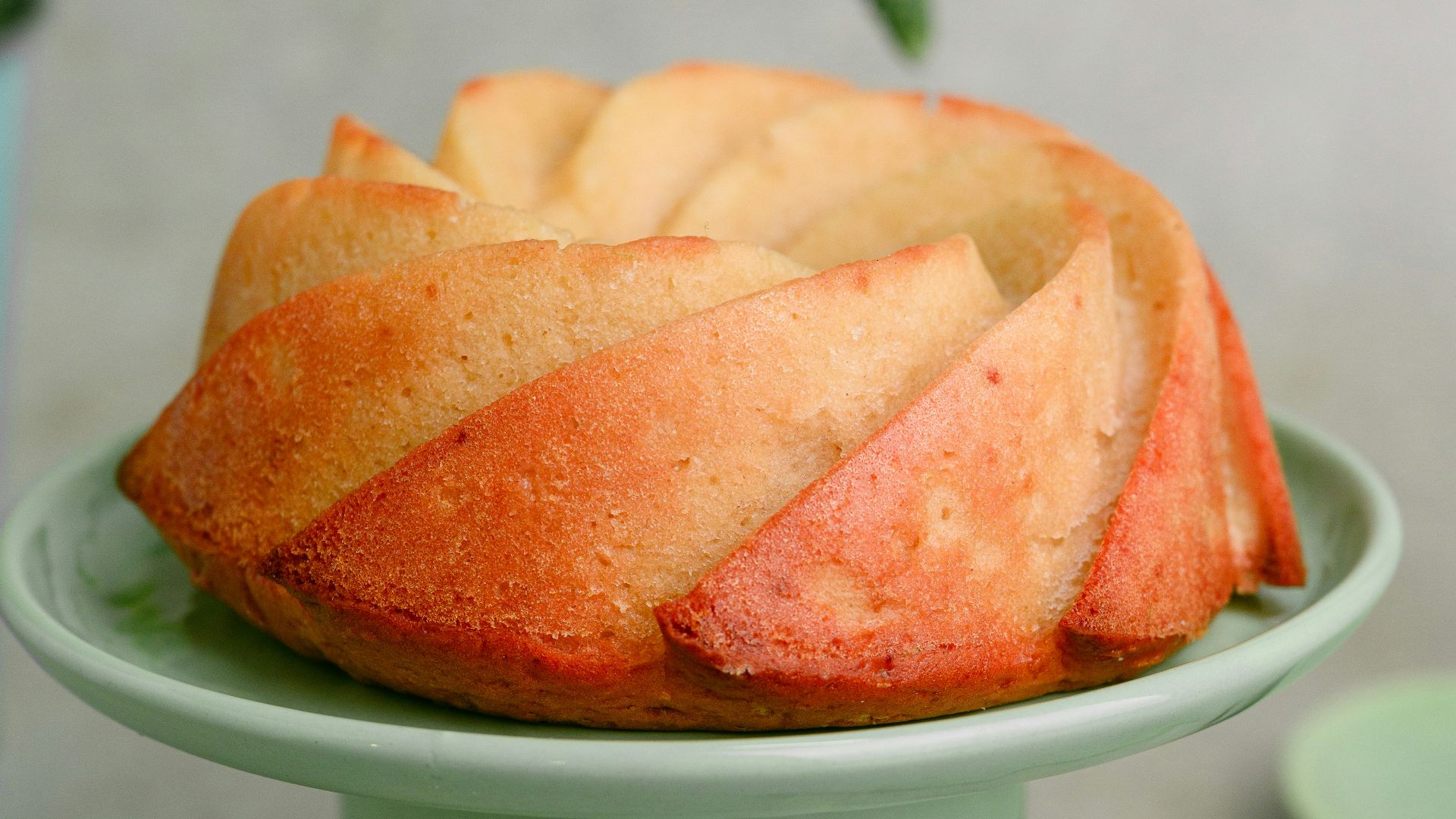 a cake sitting on top of a green cake plate