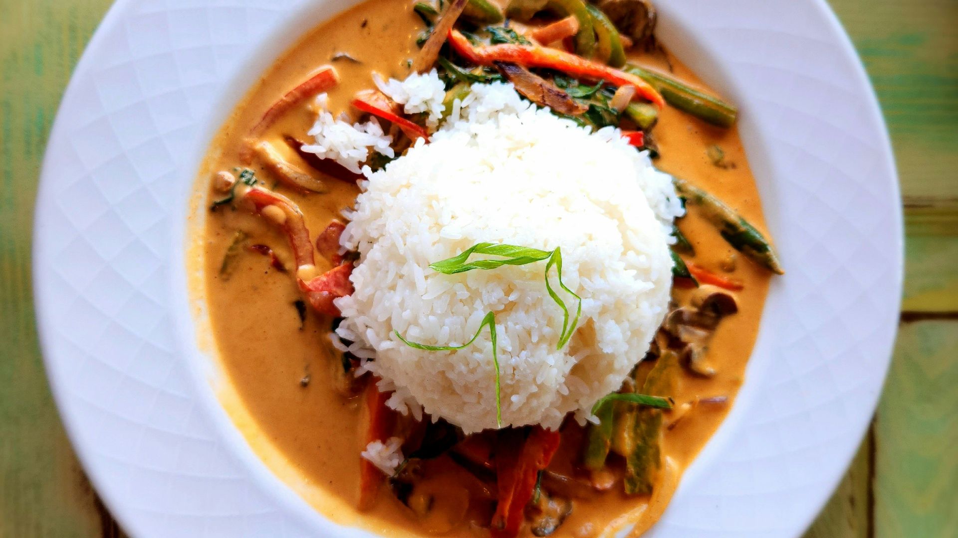 A plate of food on a wooden table