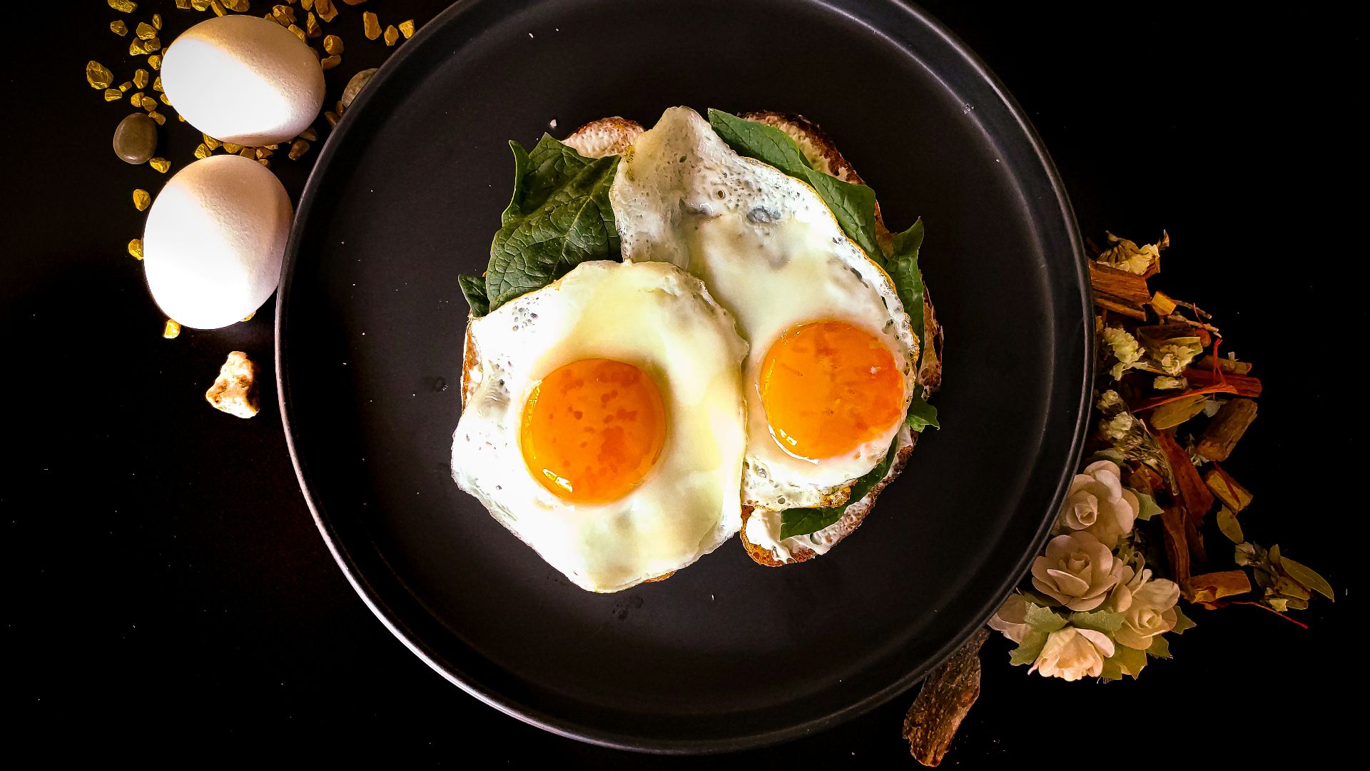 sunny side up egg on black ceramic plate
