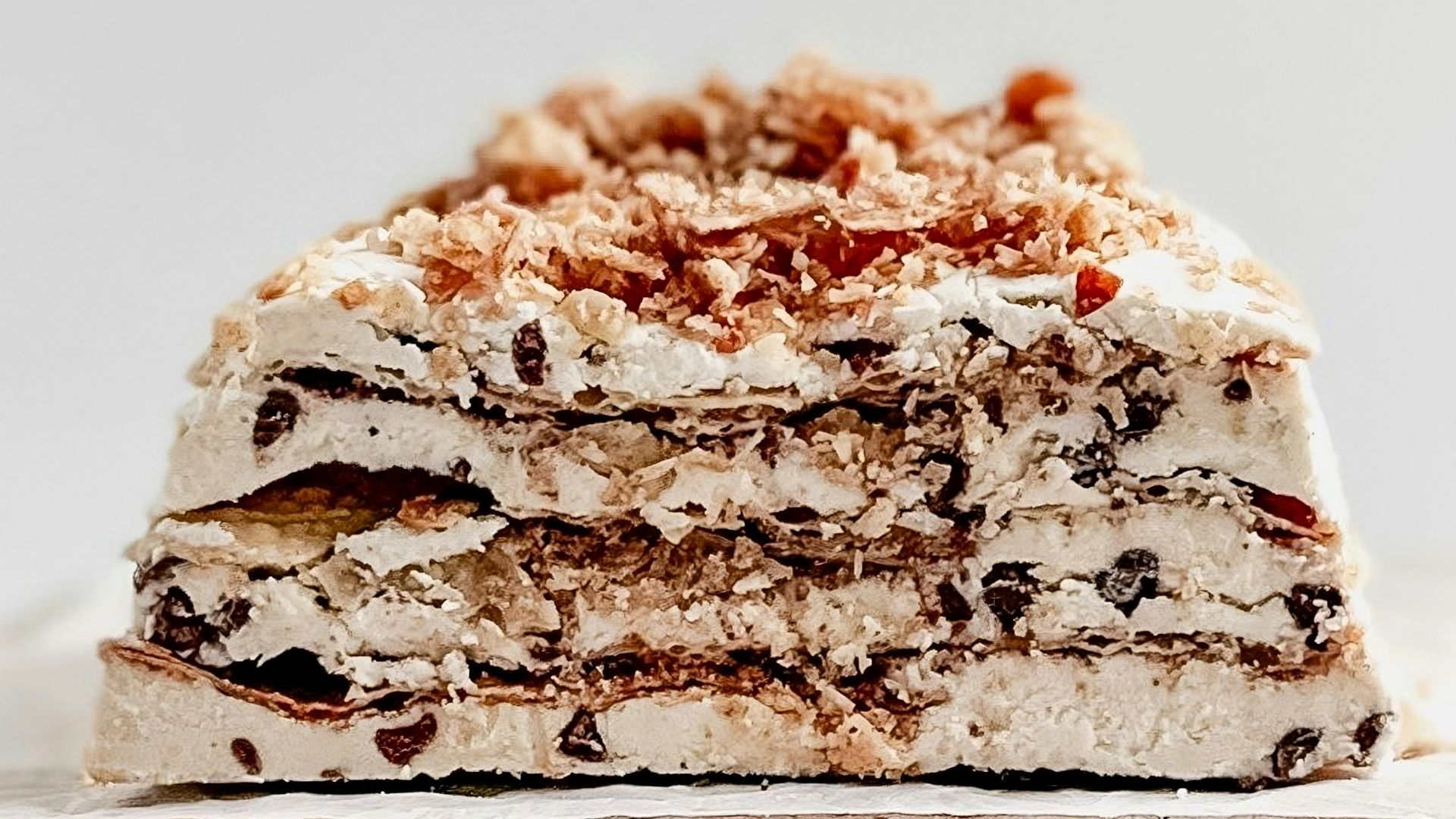 Layered ice cream cake with chocolate chips and crumbs