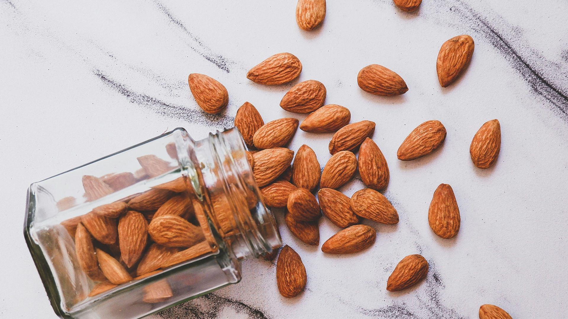 brown almond on white table