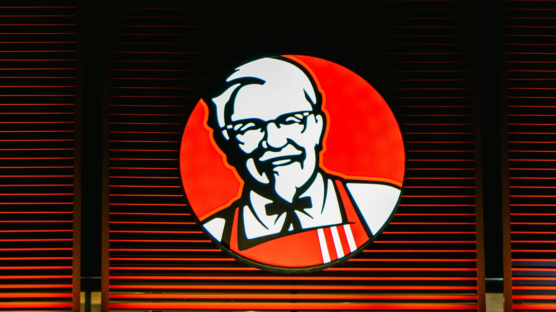 a store front with a lit up sign above it