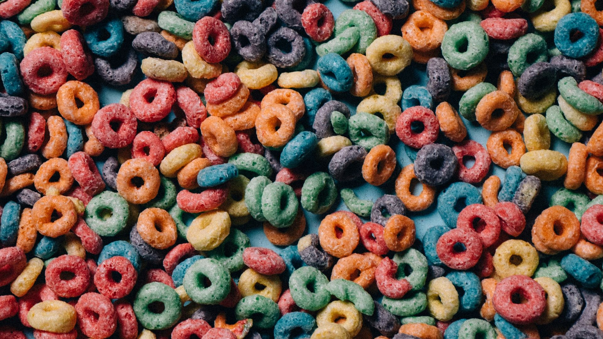 a mixture of colorful cereals and cereal rings