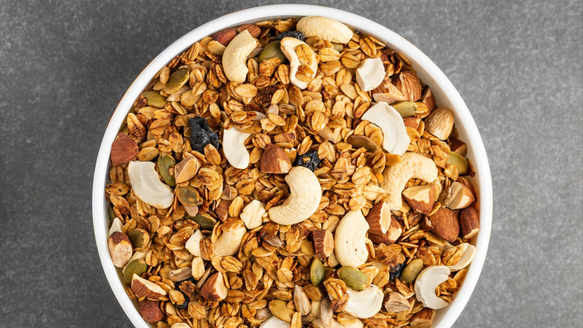brown peanuts in white ceramic bowl