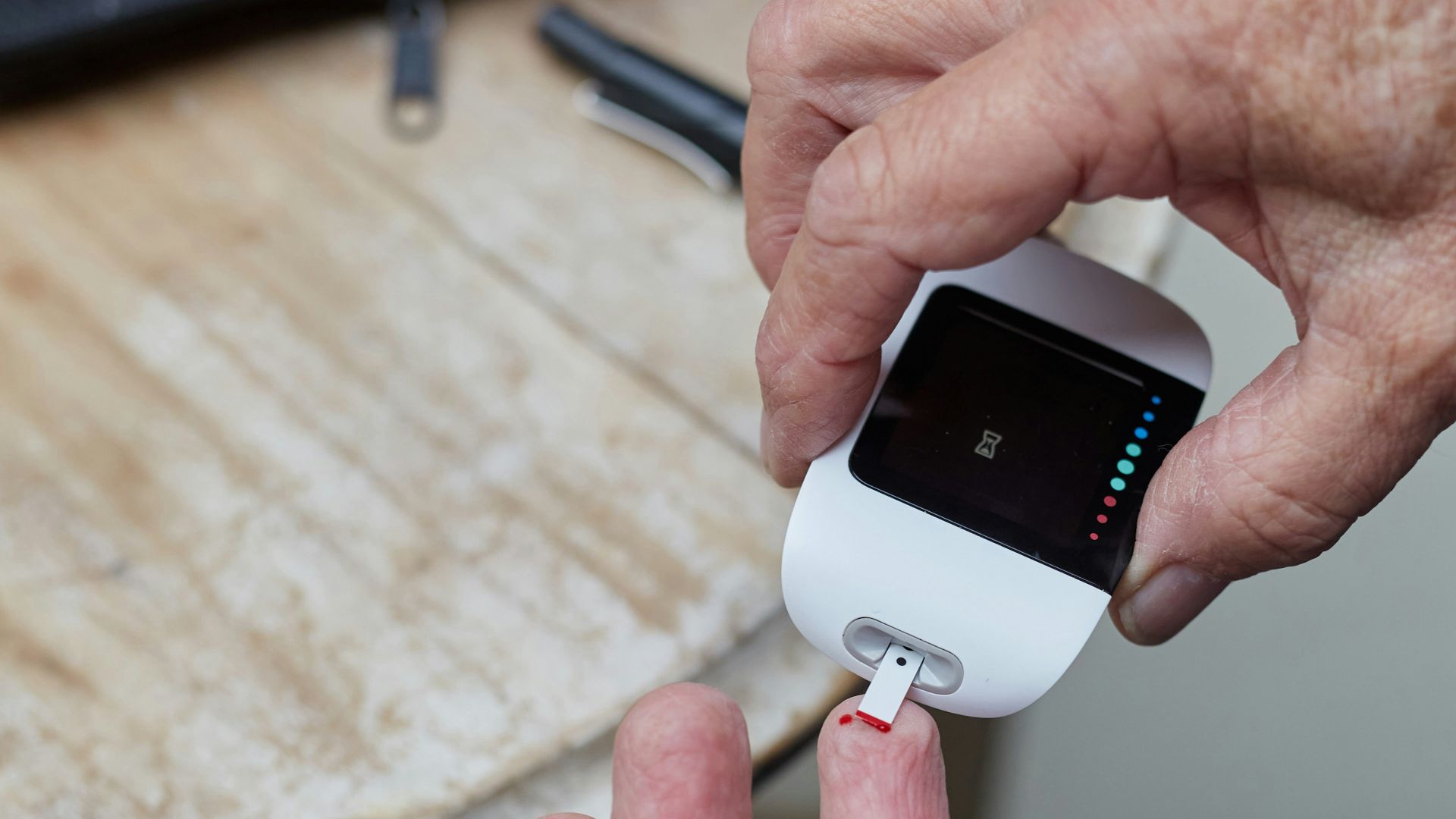 a person blood sugar testing using a gluco-meter