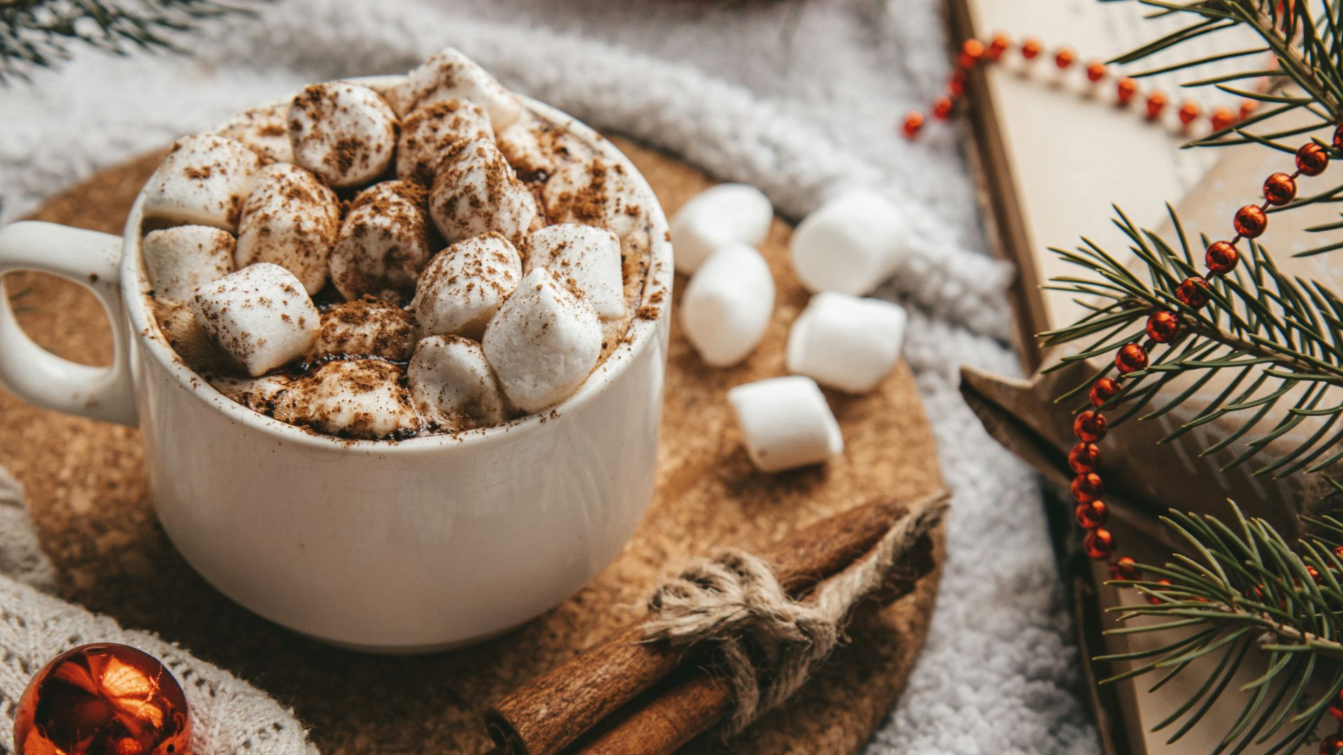 white ceramic mug with brown and white liquid inside