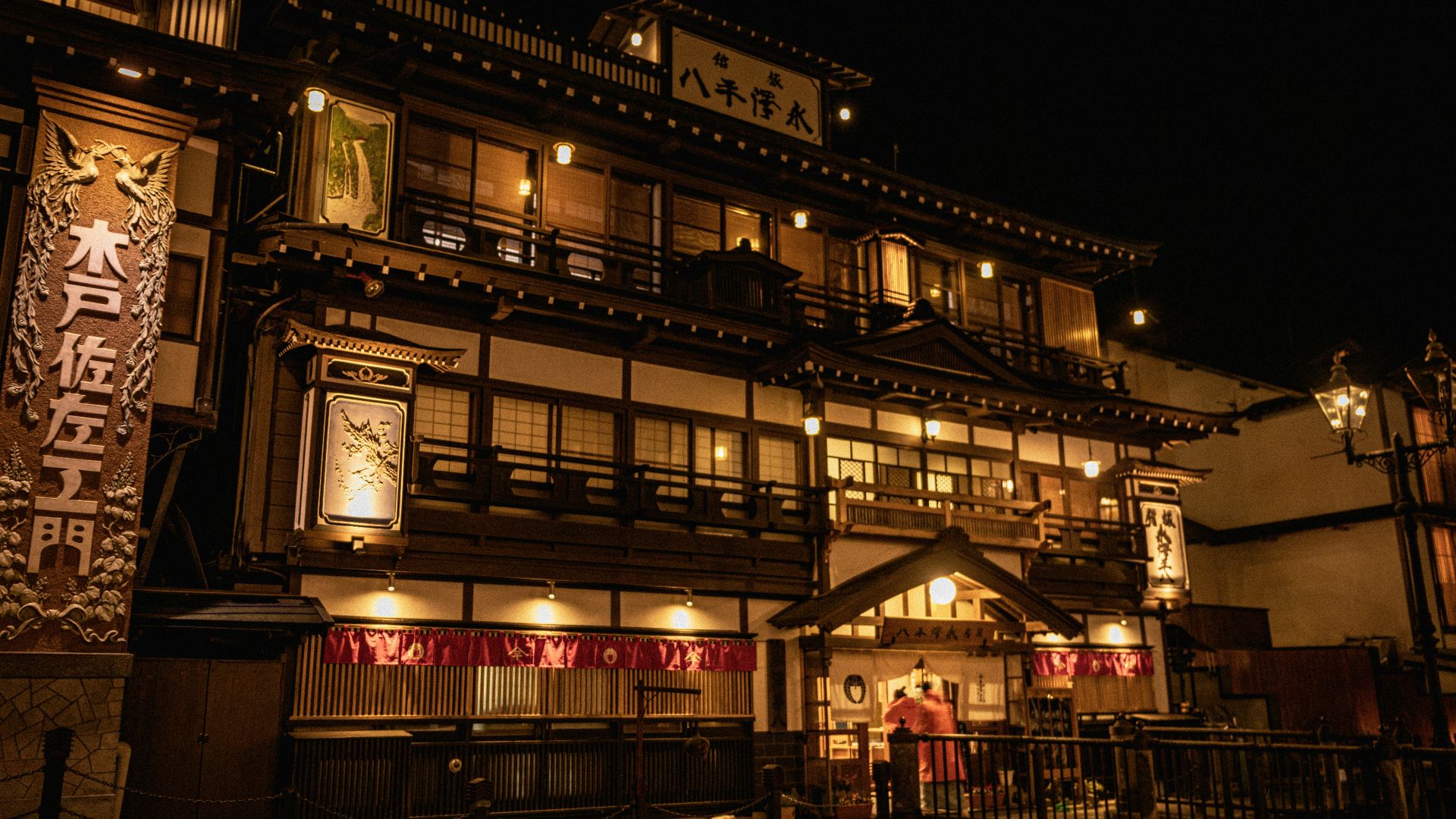 a building lit up at night with lights on
