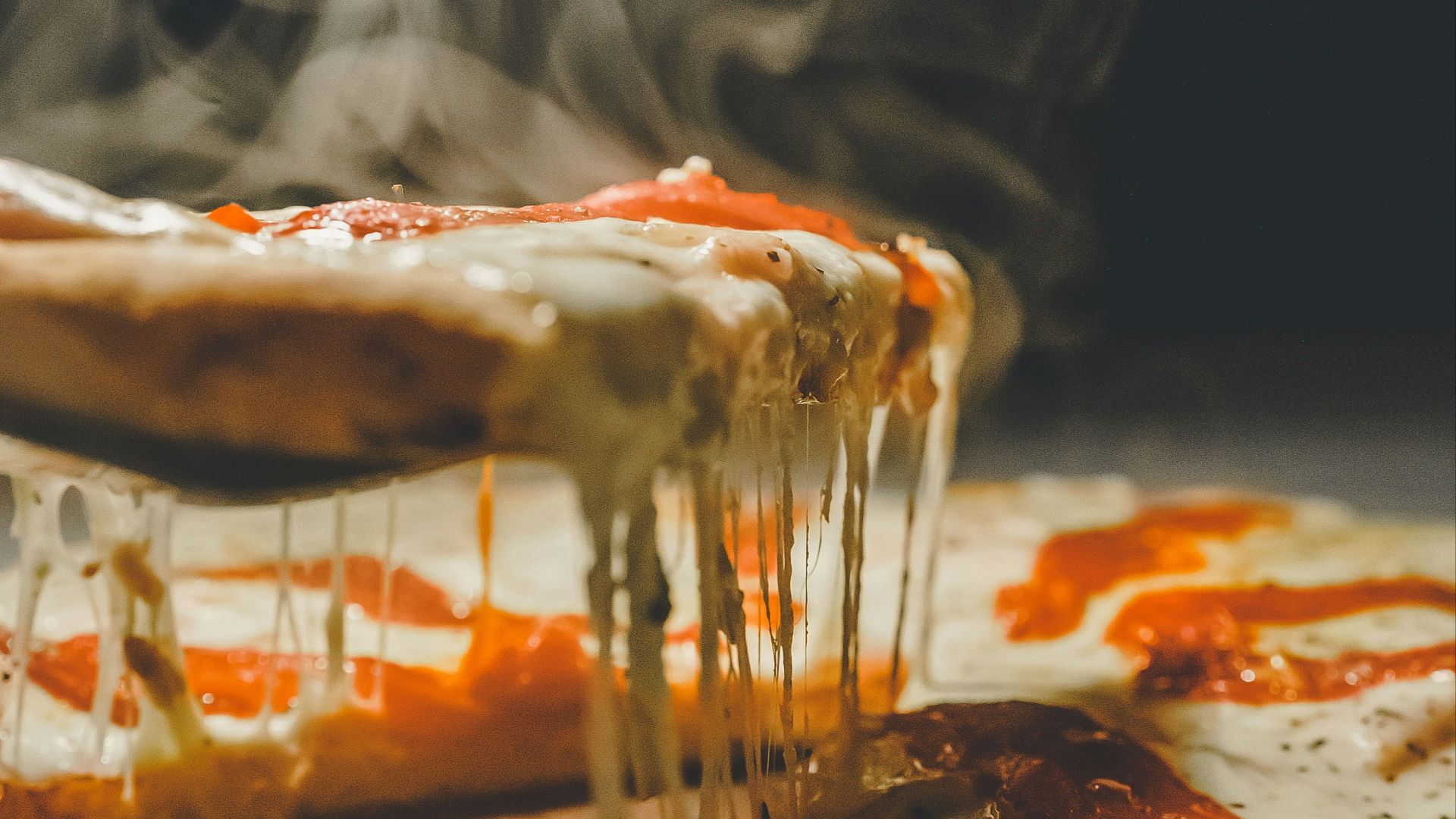 close up photo of pizza with cheese