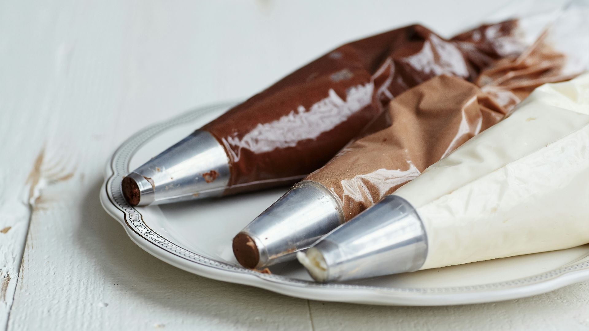 red and white plastic pack on stainless steel round tray