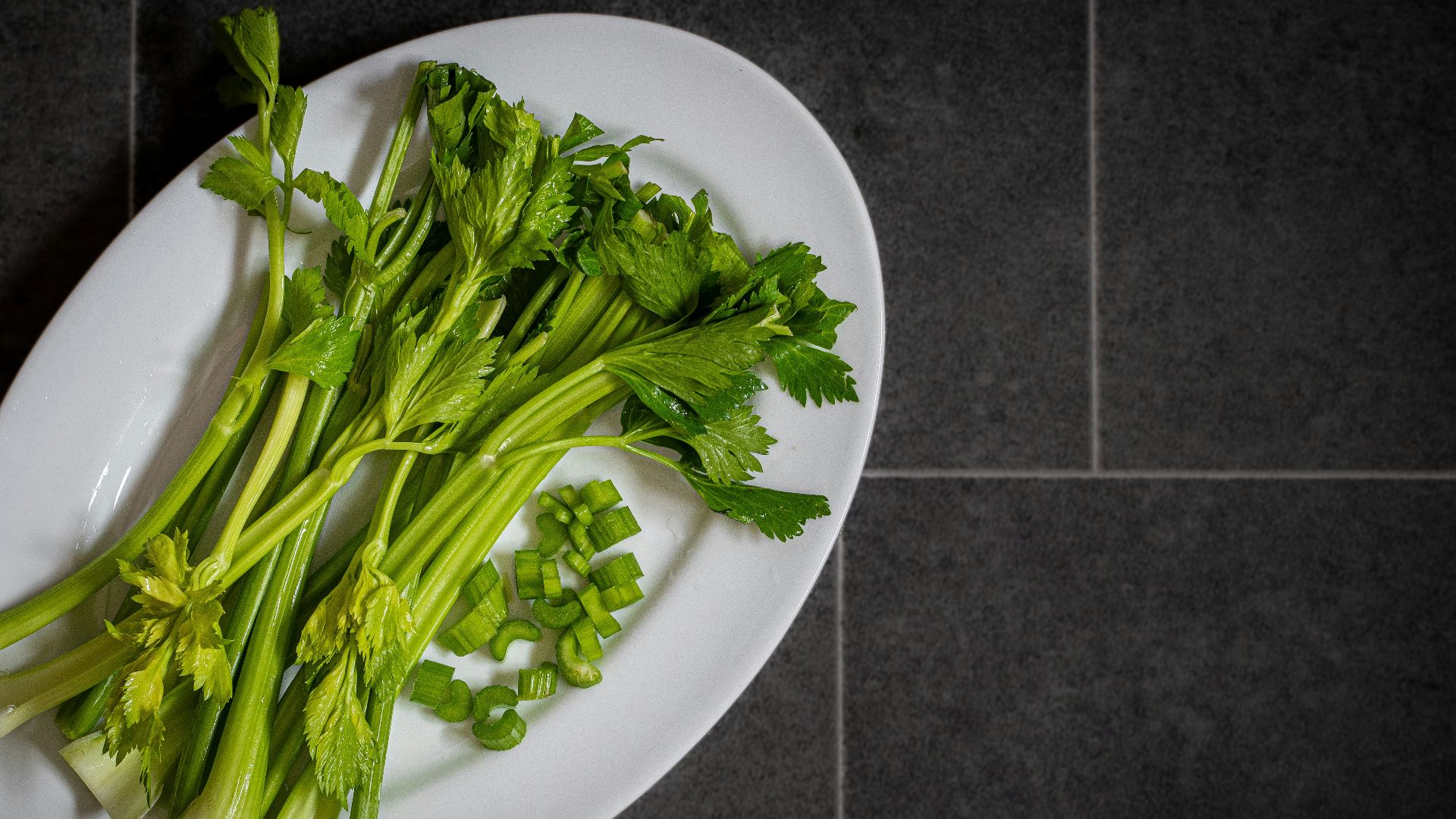 a white plate topped with green leafy vegetables
