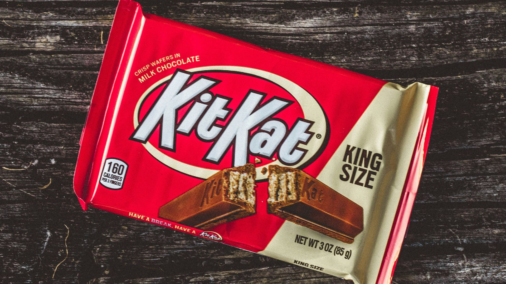 kitkat chocolate pack on black textile