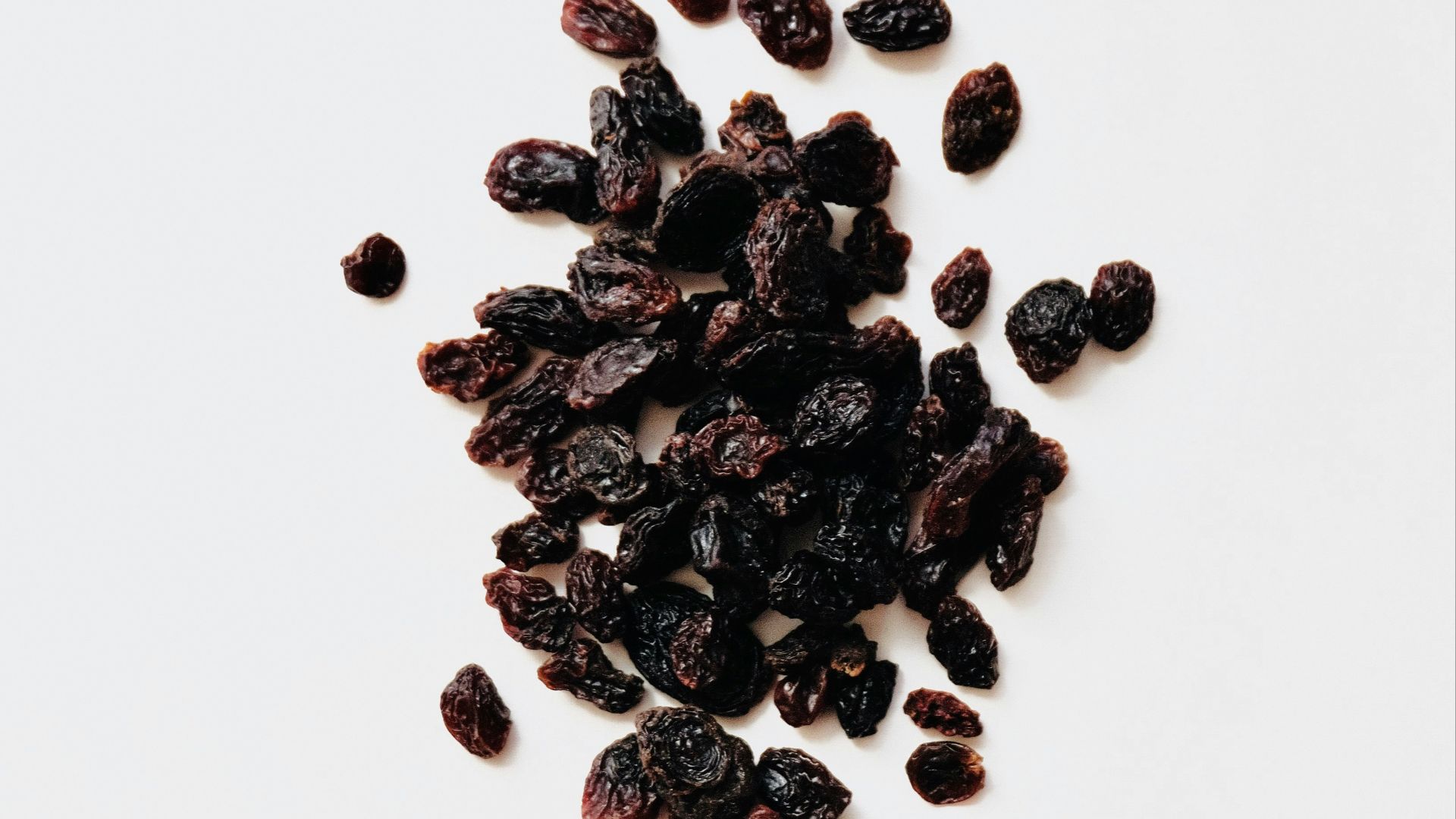 black round fruits on white background