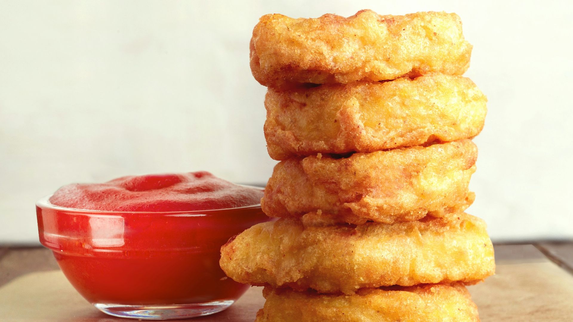 three cookies on brown wooden chopping board