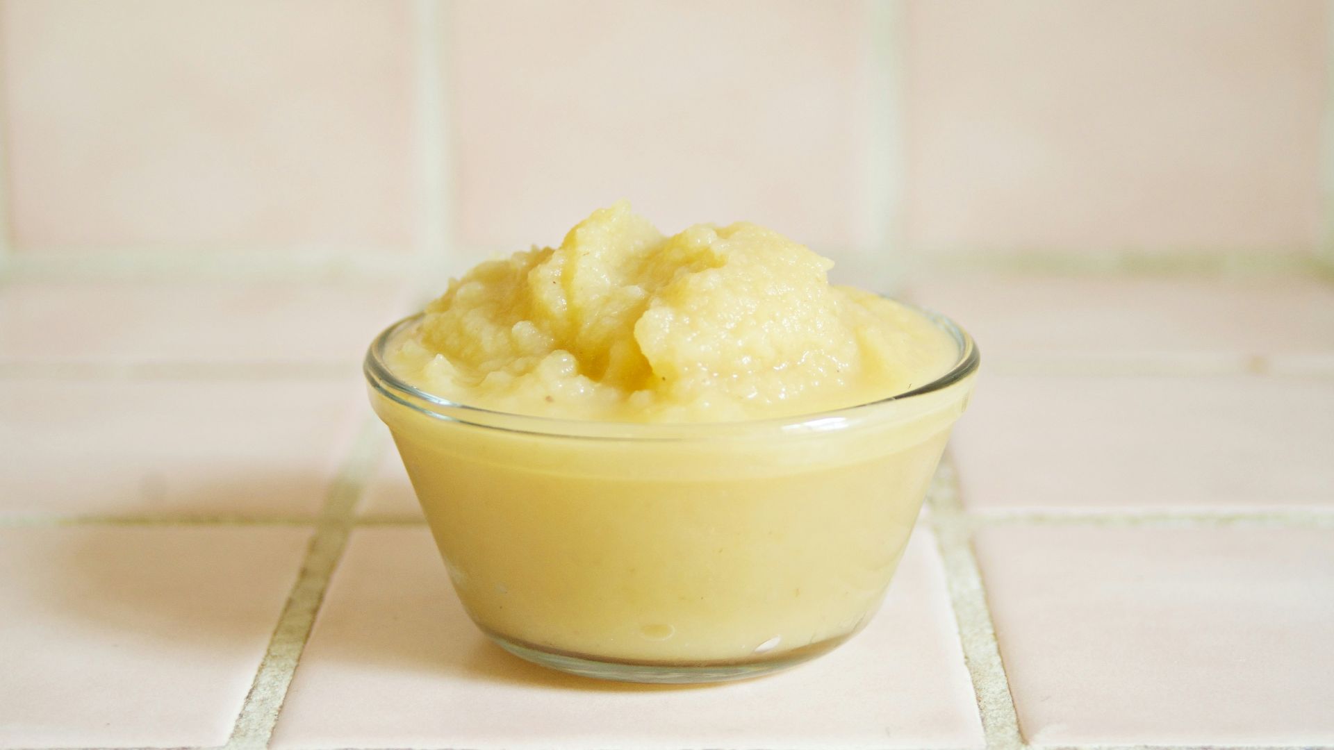 yellow cream in clear glass bowl