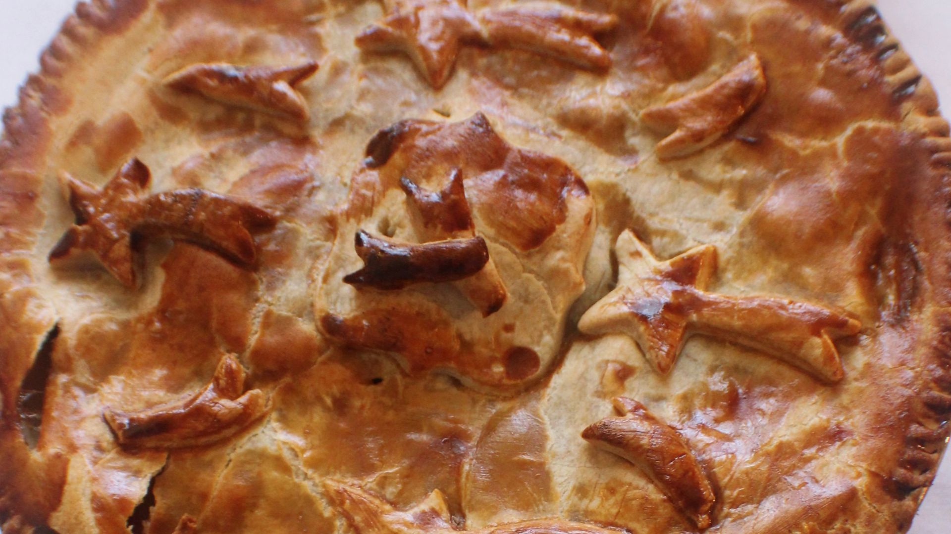 pie on brown wood slab