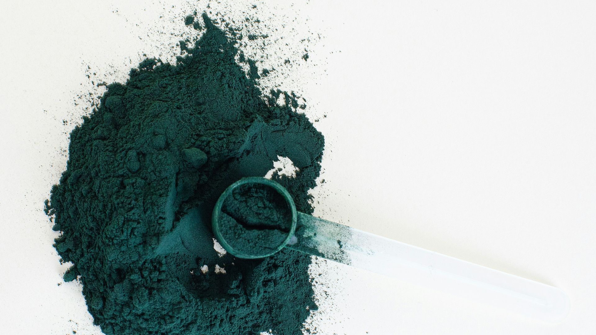 a close-up of a syringe with green liquid