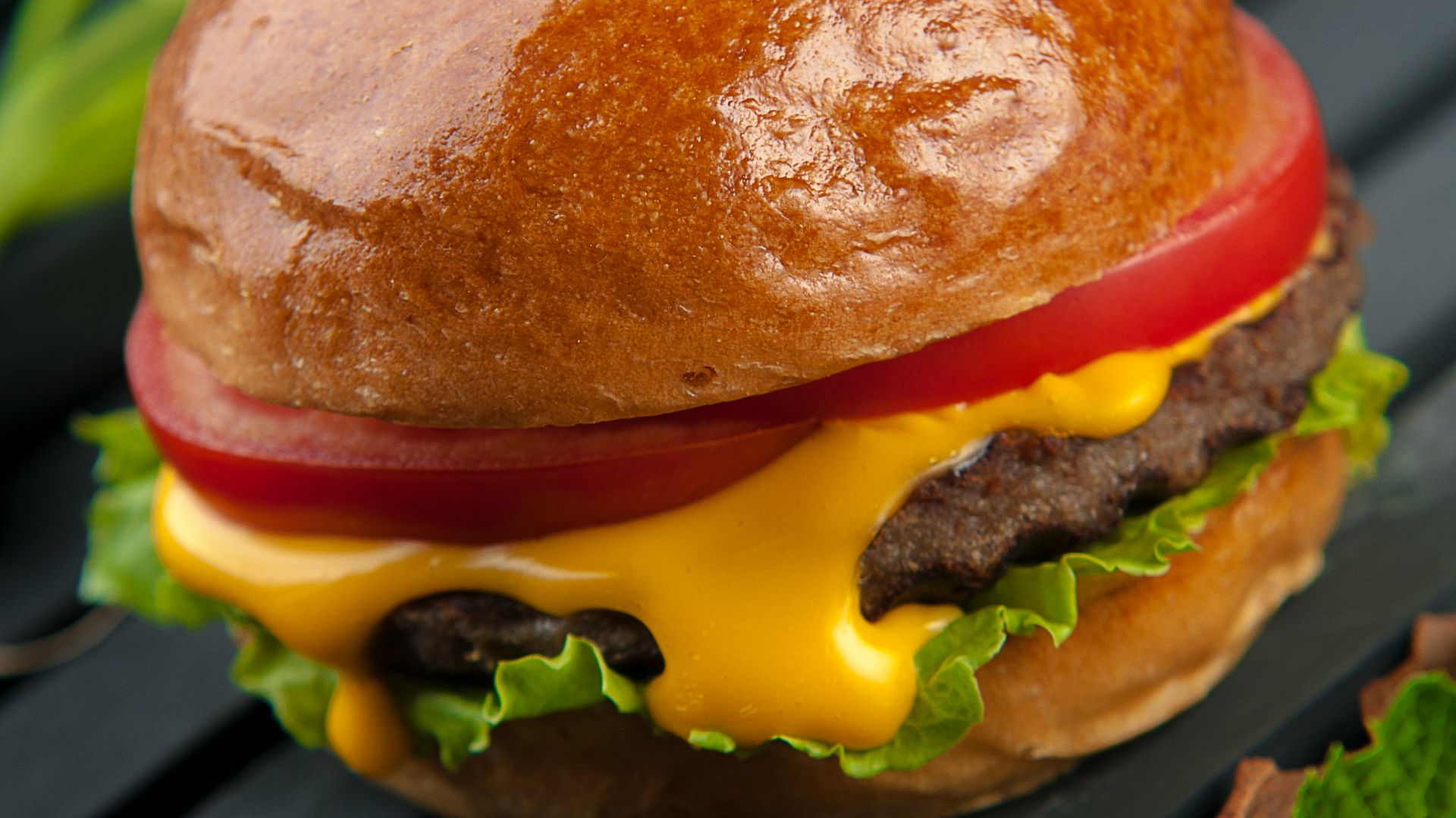 cheese burger on a wooden surface