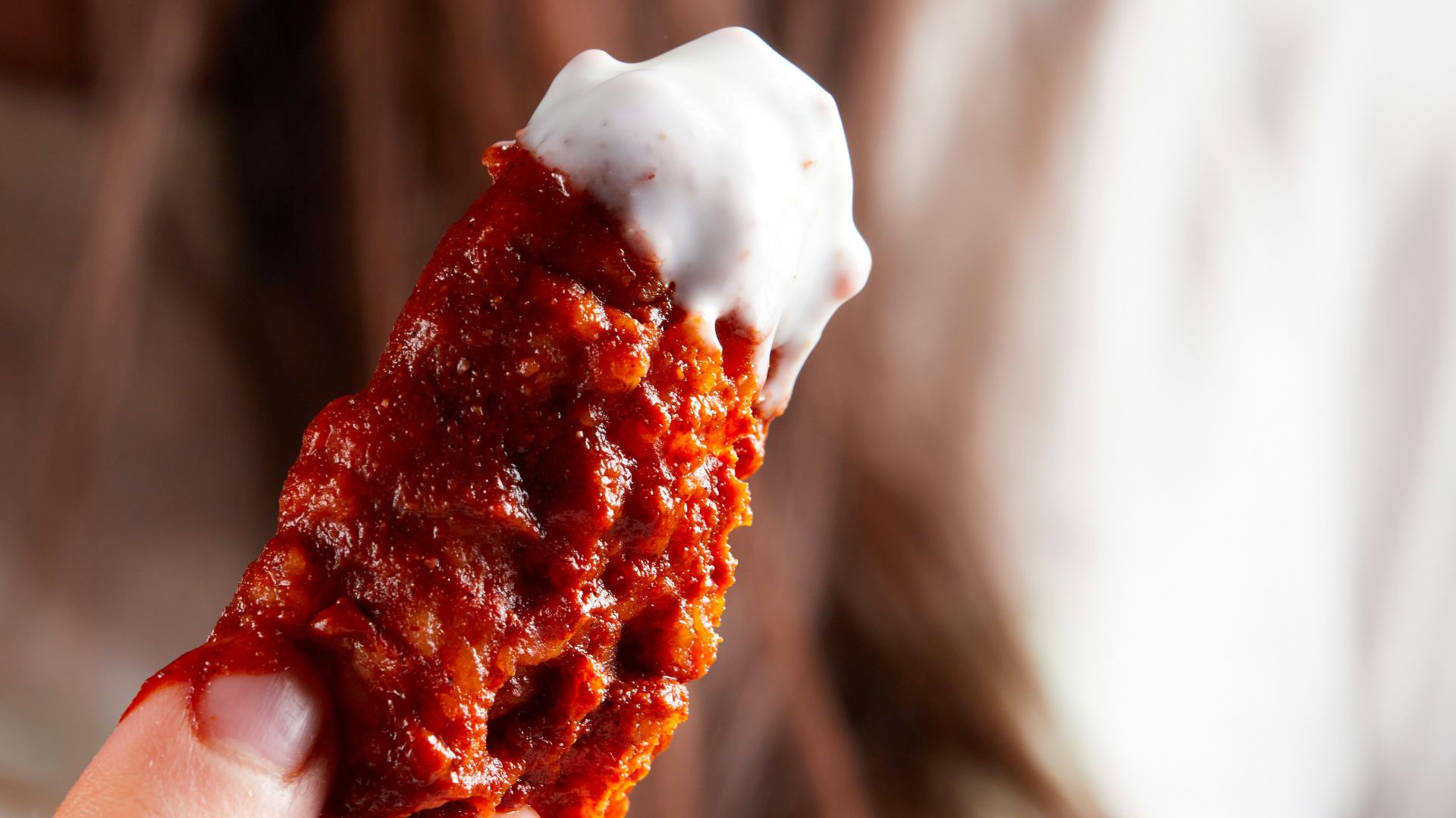 person holding brown and white ice cream