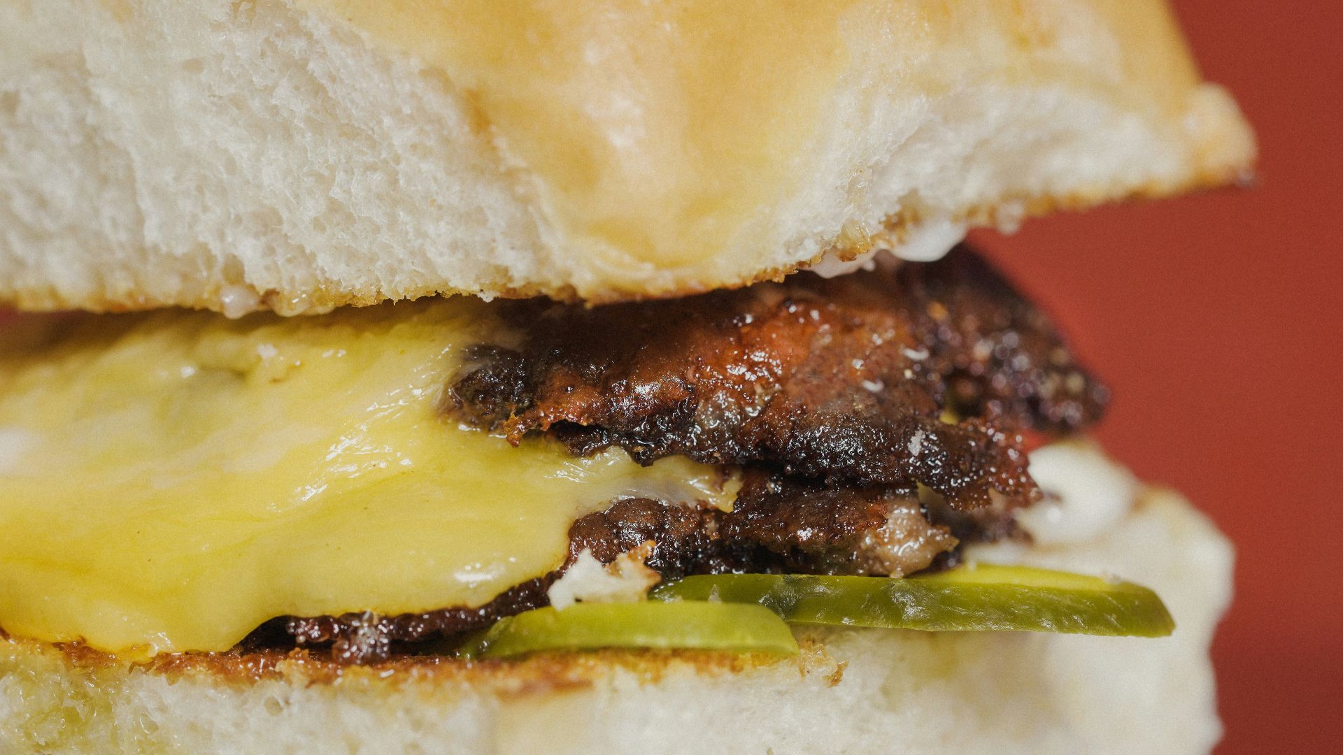 a close up of a sandwich with meat and cheese