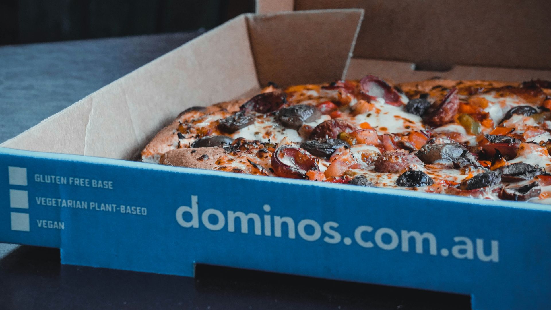 a blue box with a pizza inside of it