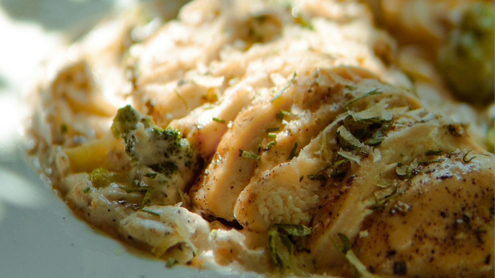 Chicken dish with vegetables and a side.