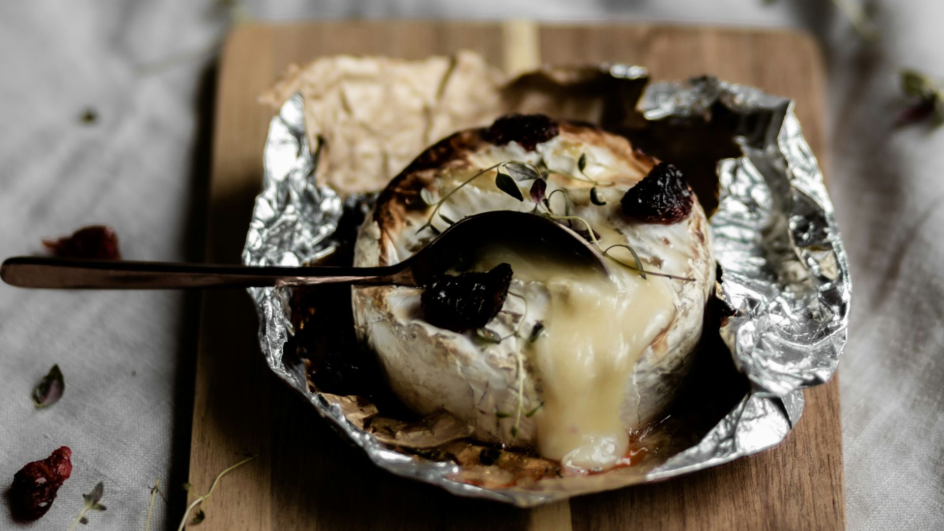 brown and white cake on brown wooden tray