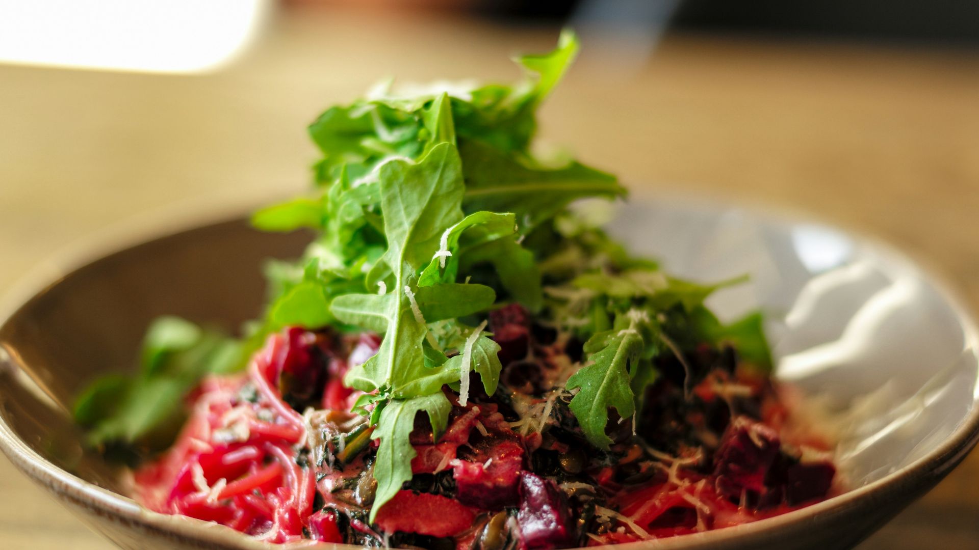 vegetable salad on brown ceramic bowl