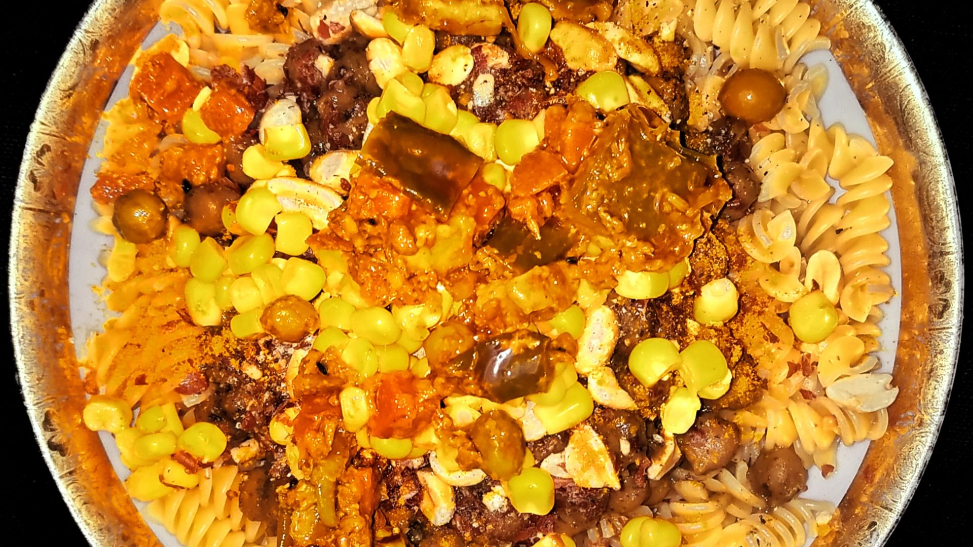 File:Chickpea curry on rotini, with corn, hot mixed Indian pickles, peanuts, curry powder, and black pepper - Massachusetts.jpg