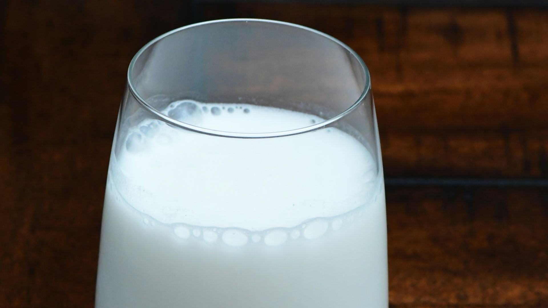 clear drinking glass with white liquid