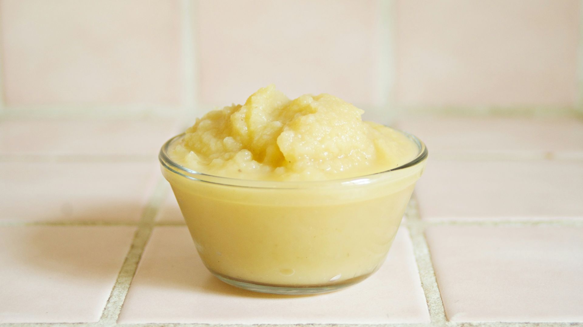 yellow cream in clear glass bowl