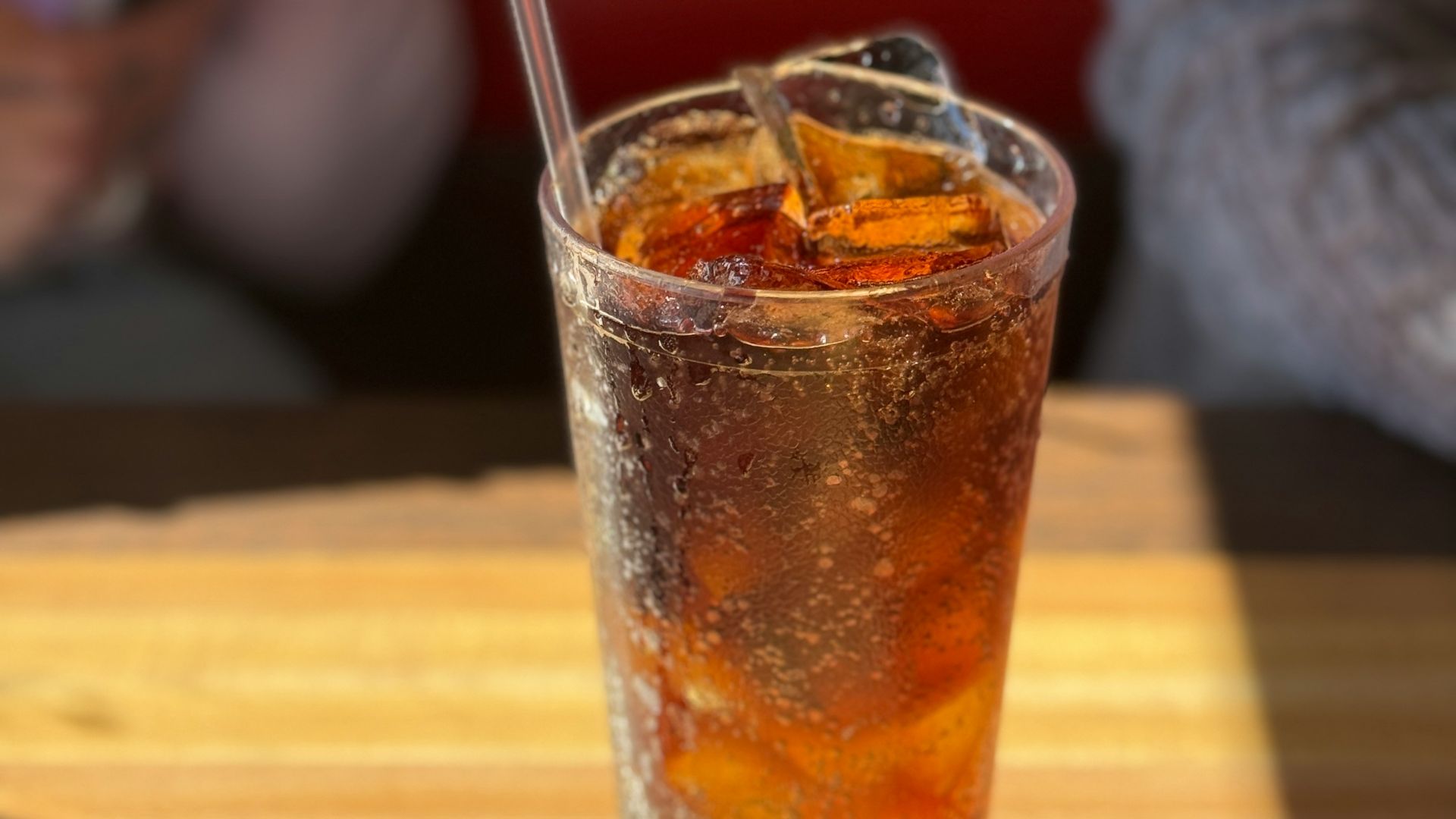 a drink sitting on top of a wooden table