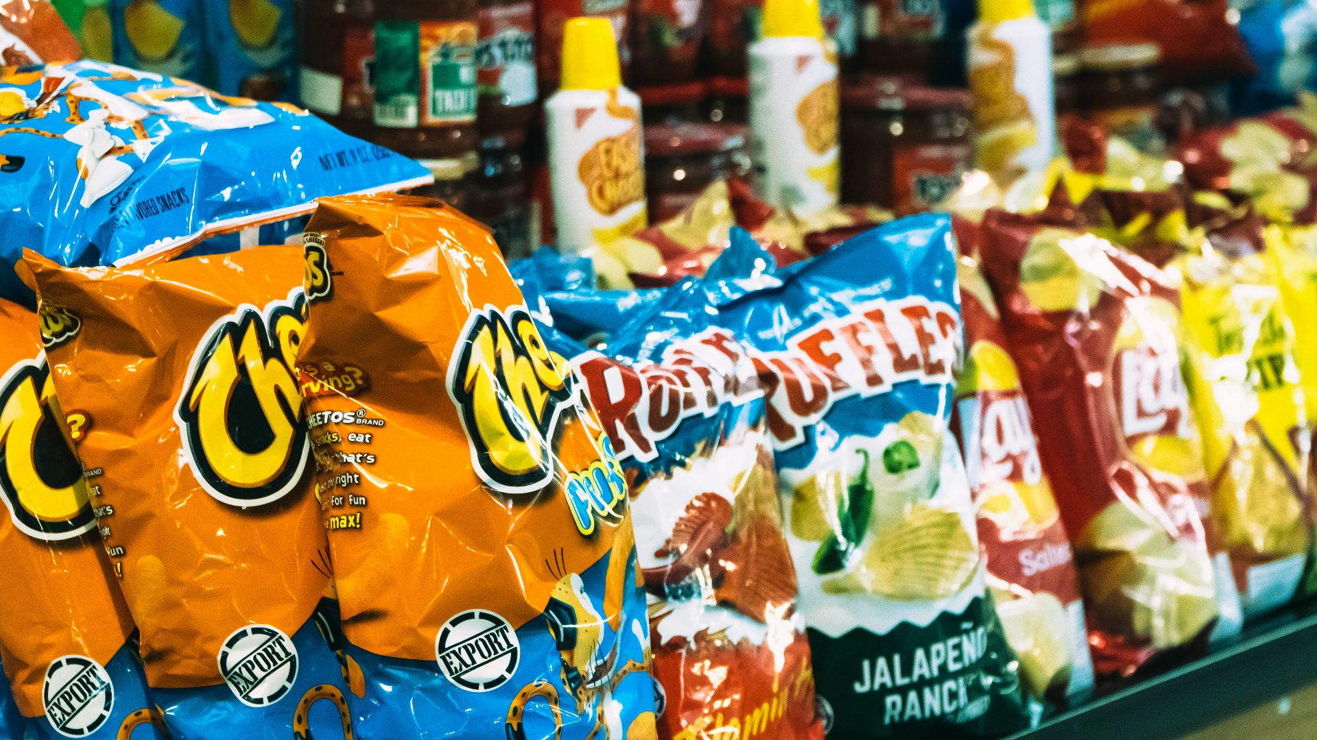 bags of chips are on display in a store