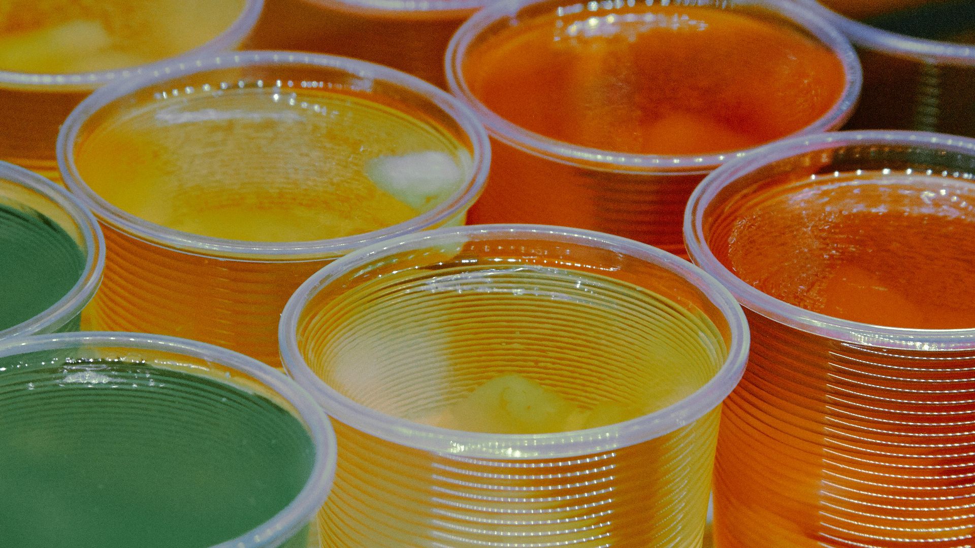 clear glass jars with yellow liquid