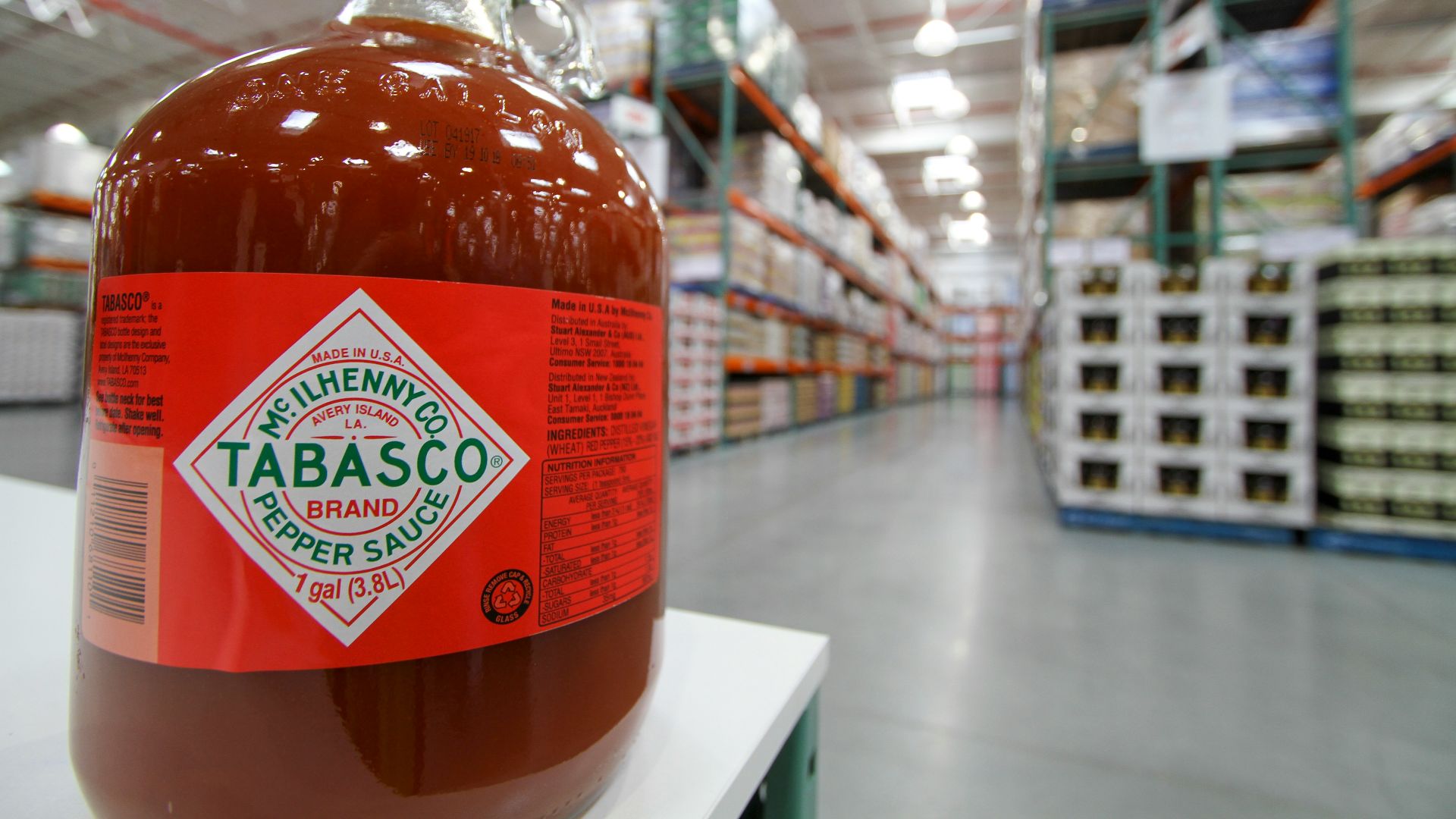 a bottle of tabasco sitting on a shelf in a store