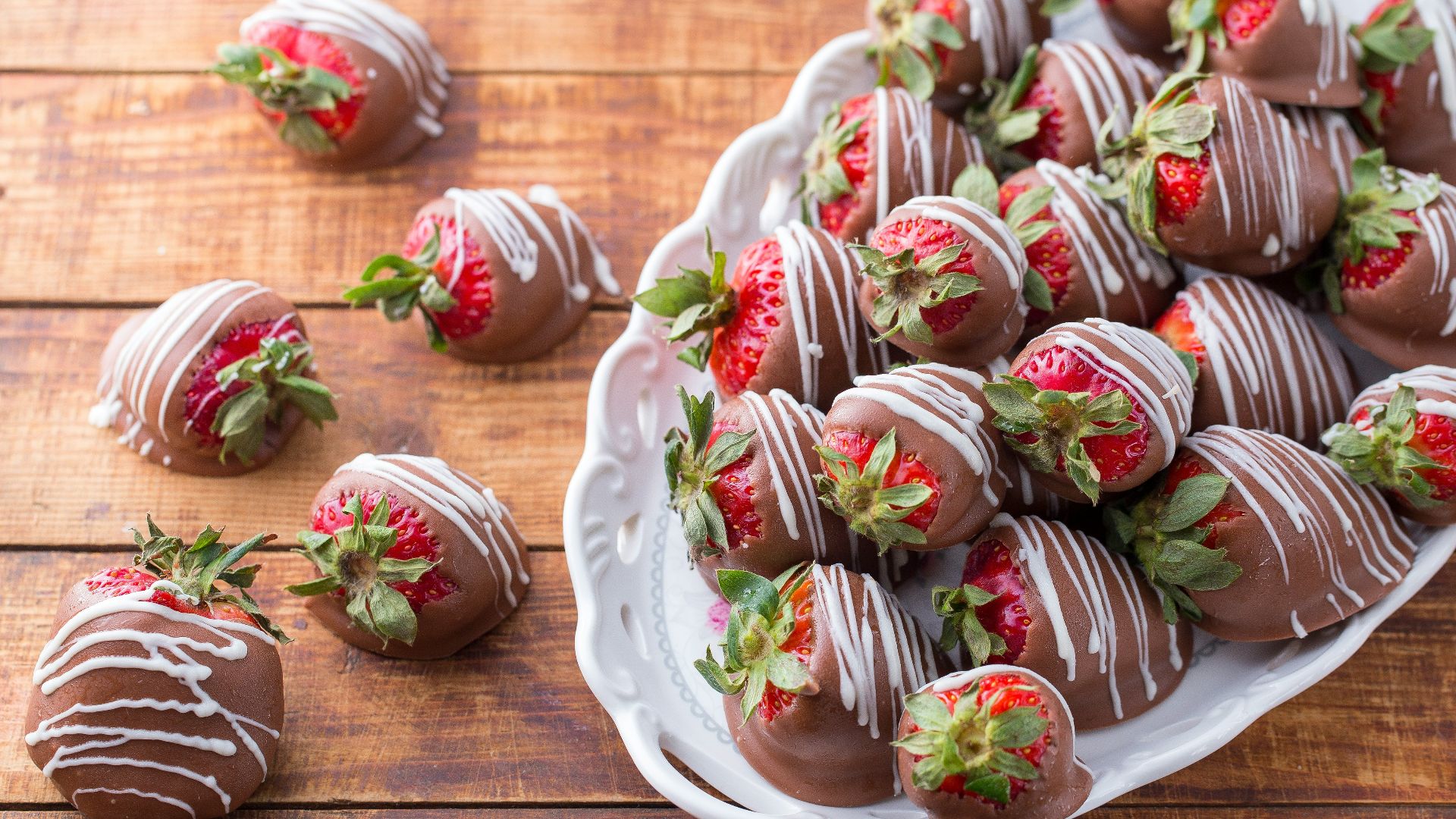 bowl of strawberry covered with chocolates
