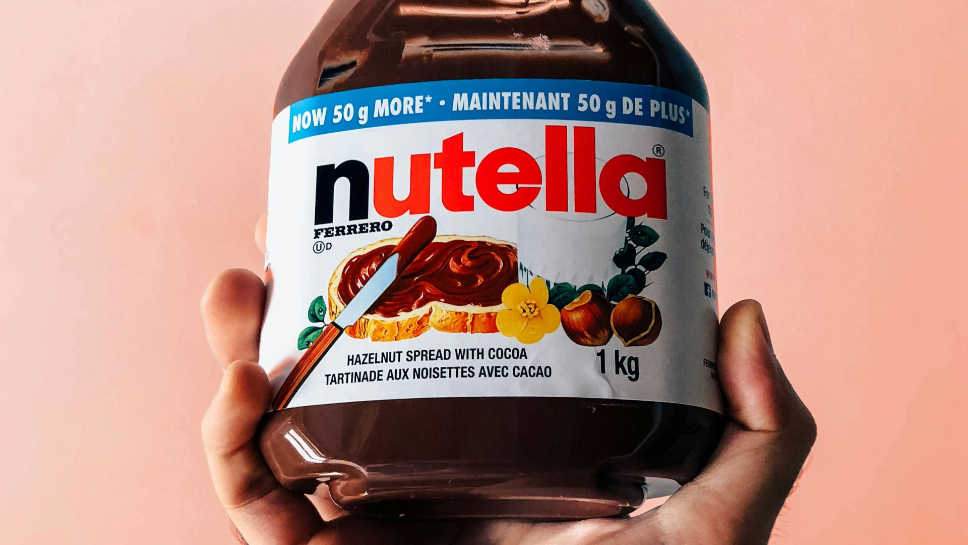 person holding Nutella jar